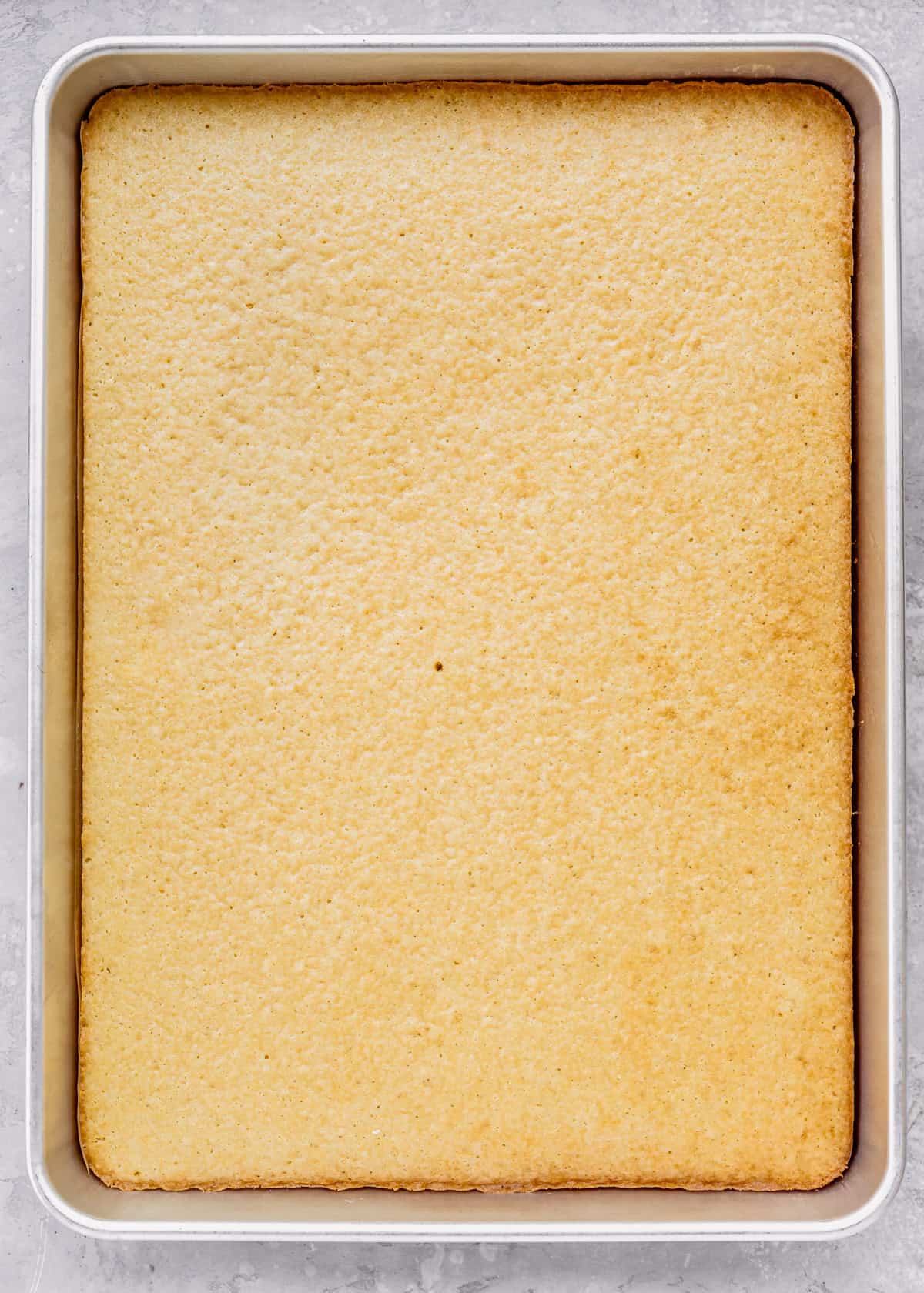 Vanilla Sheet Cake in a pan after baking