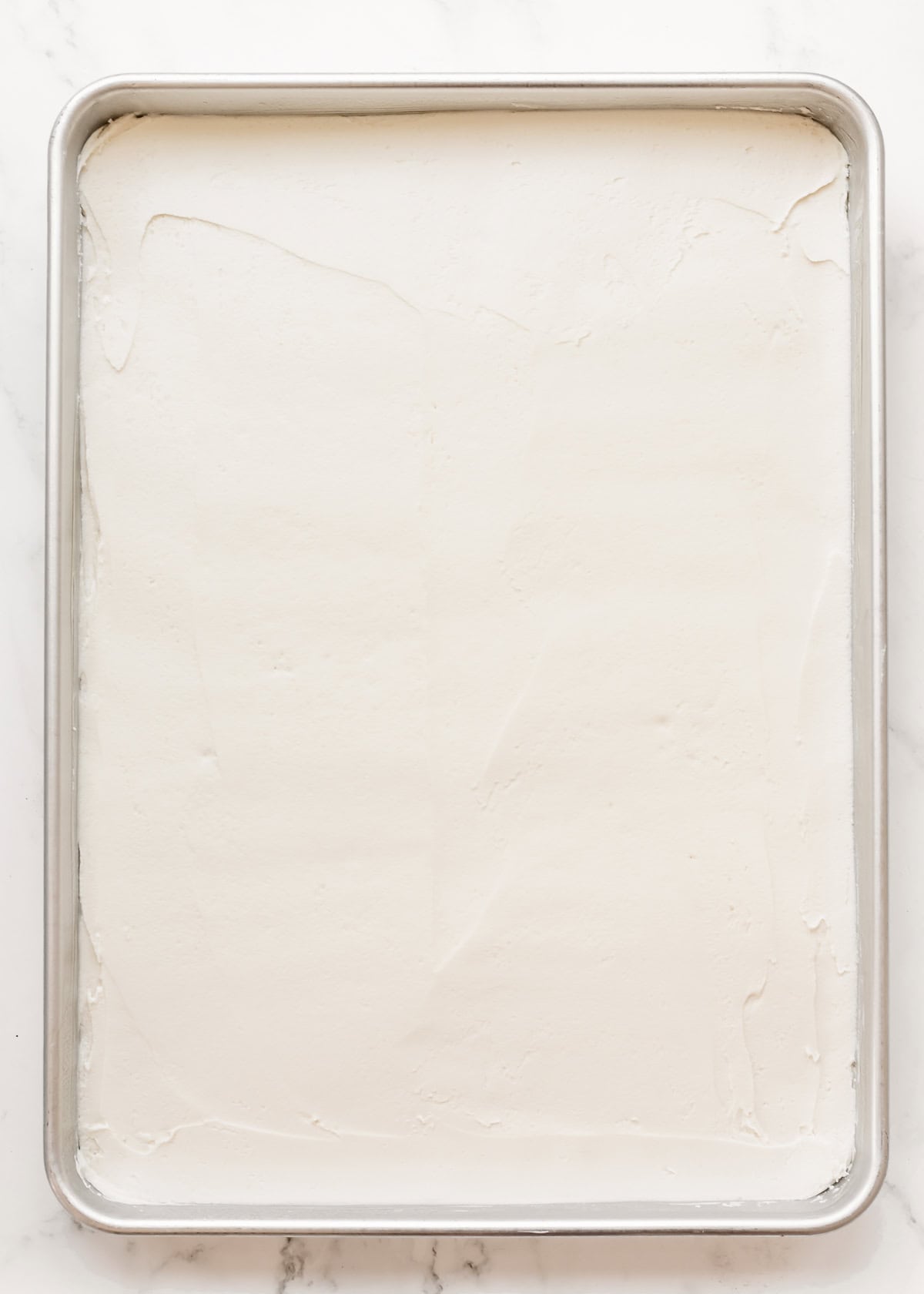 How to Make a Flag Cake - frosting spread evenly over the cake
