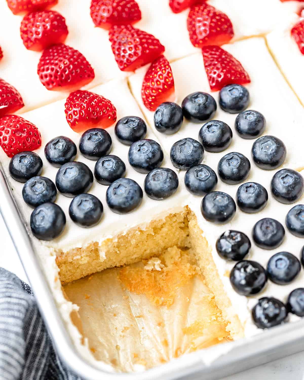 American Flag Cake with one piece cut out of it