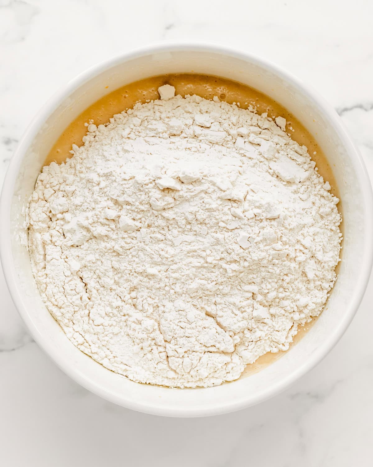 How to Make a Flag Cake - dry ingredients added to wet ingredients before mixing