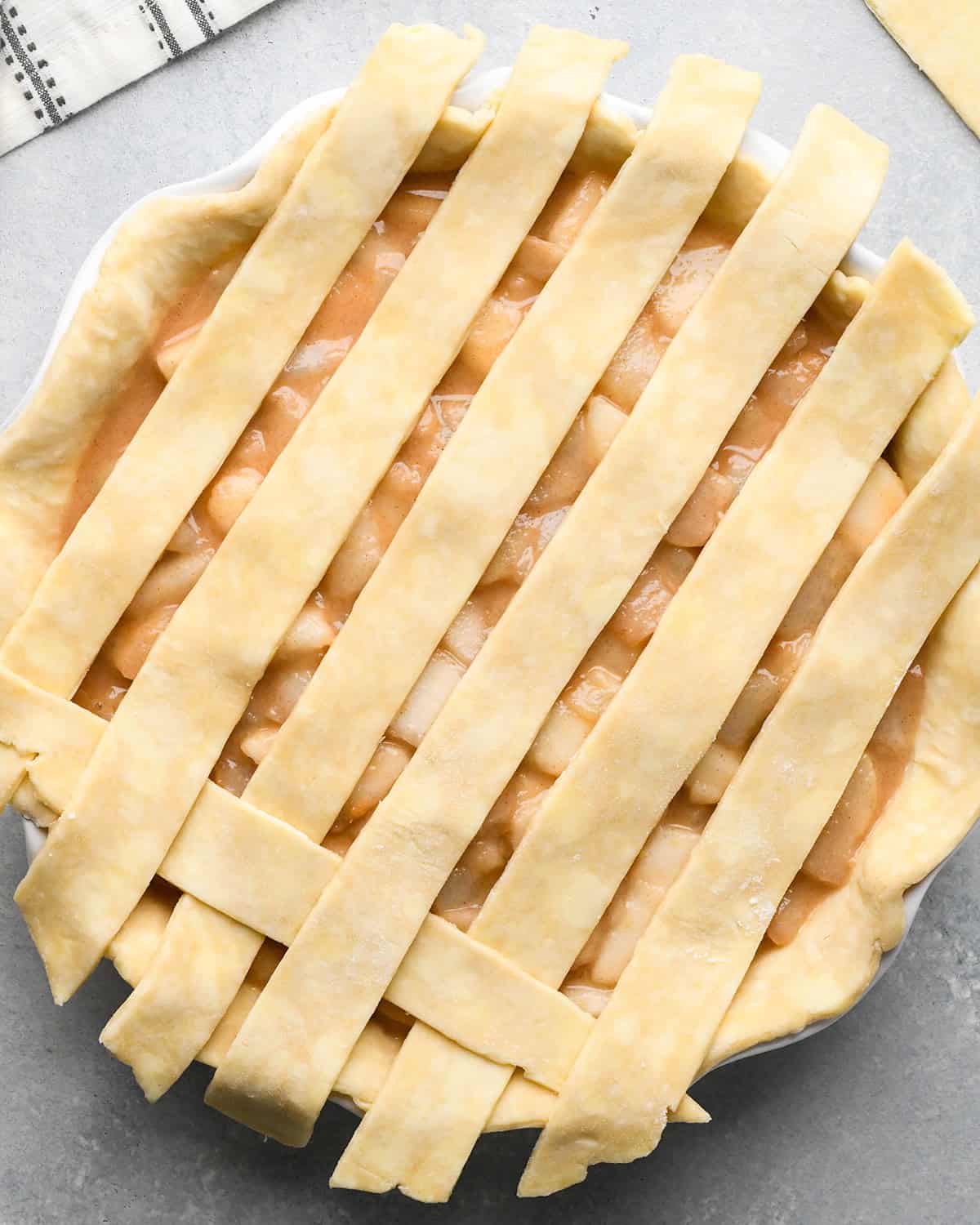 How to Make a Lattice Pie Crust - folding the horizontal strips back over the vertical strip