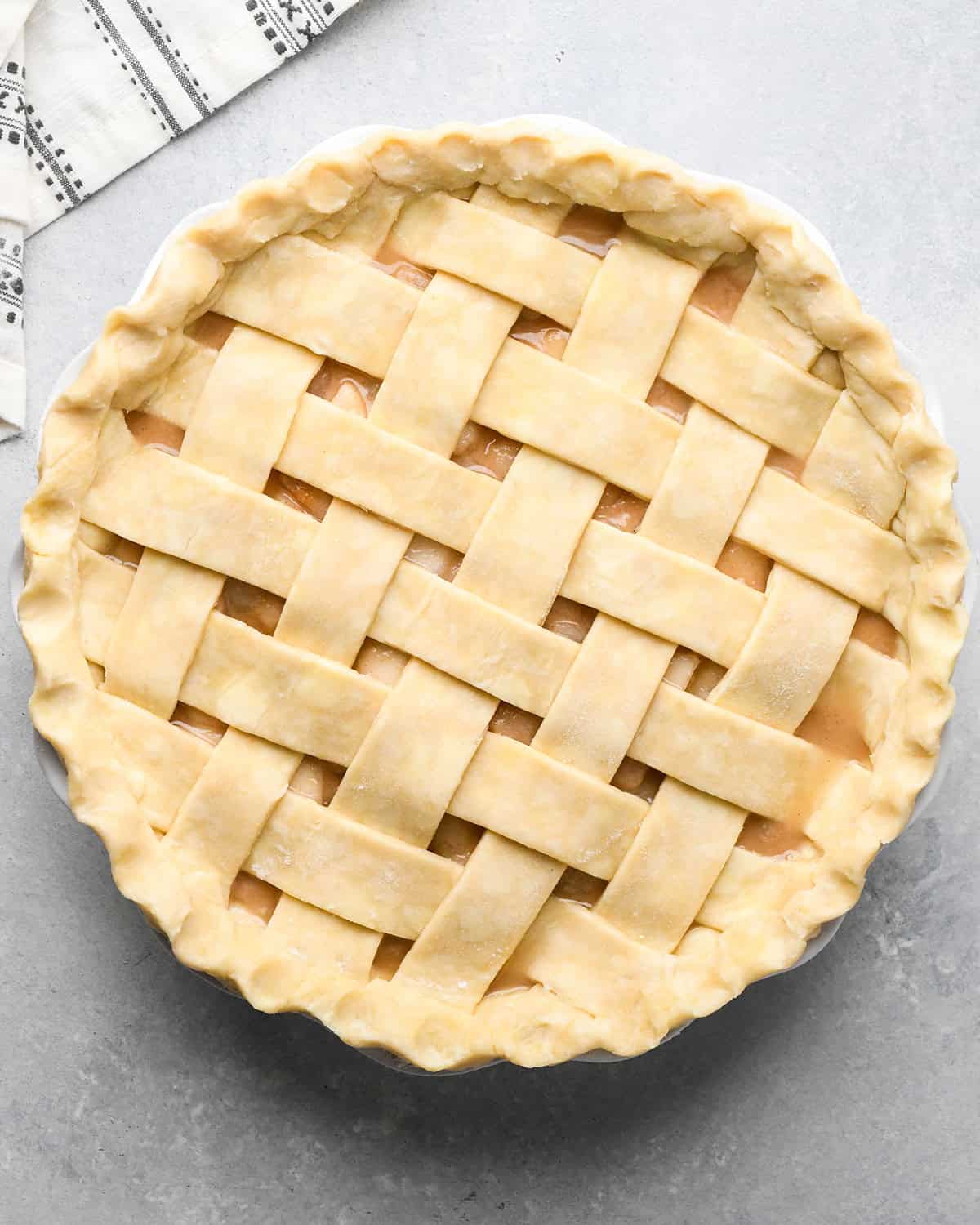 How to Make a Lattice Pie Crust - pinching the edges to make a fluted edge. Final crust before baking