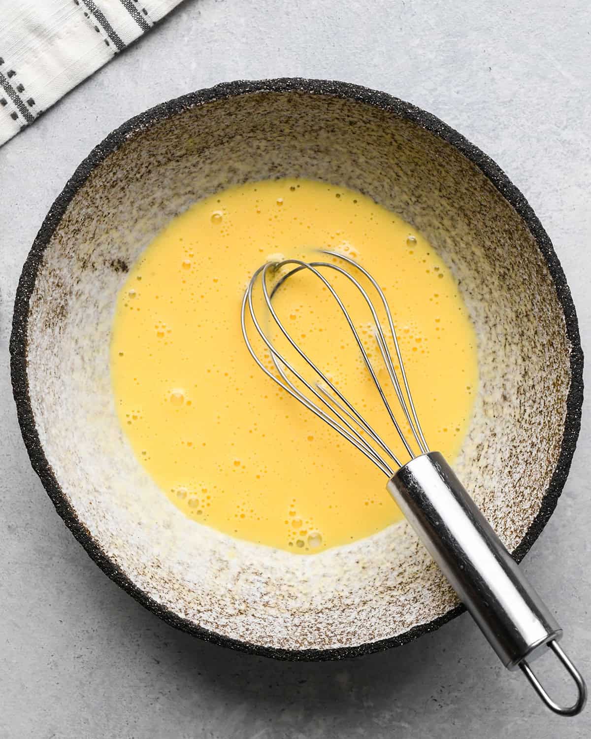 How to Make a Lattice Pie Crust - egg wash ingredients in a bowl after whisking
