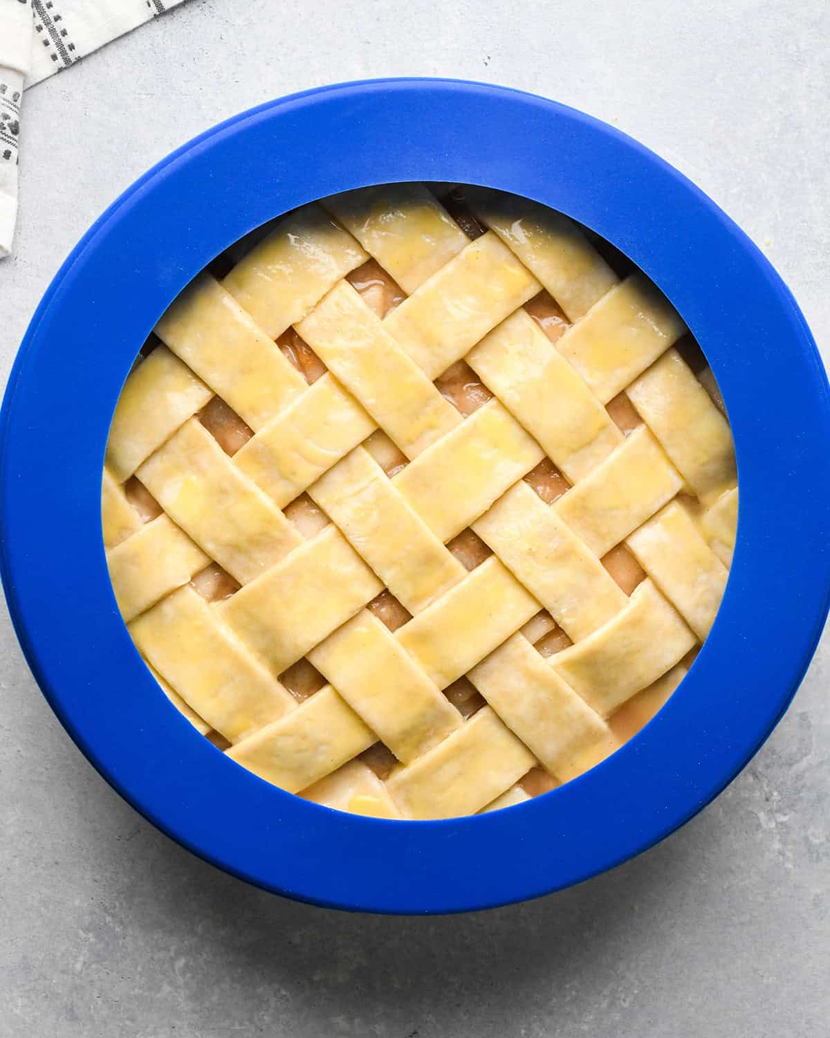 How to Make a Lattice Pie Crust - pie crust shield over crust before baking