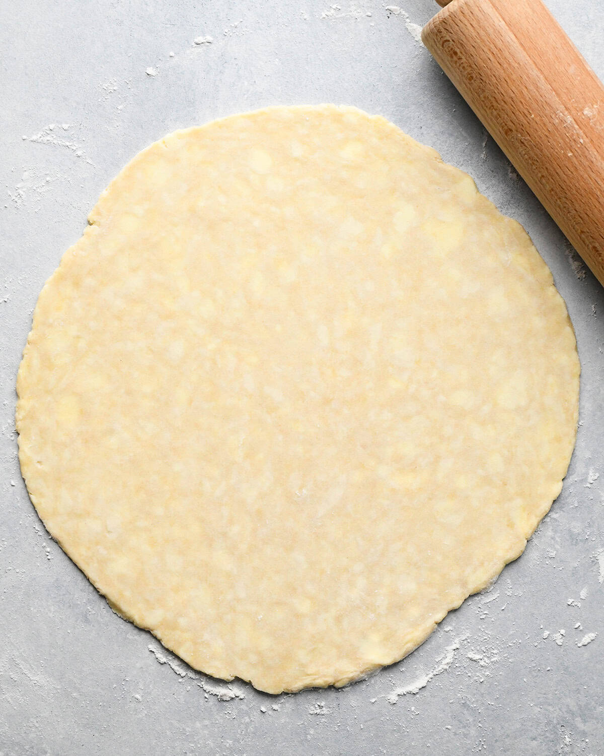 How to Make a Lattice Pie Crust - rolling out the bottom crust