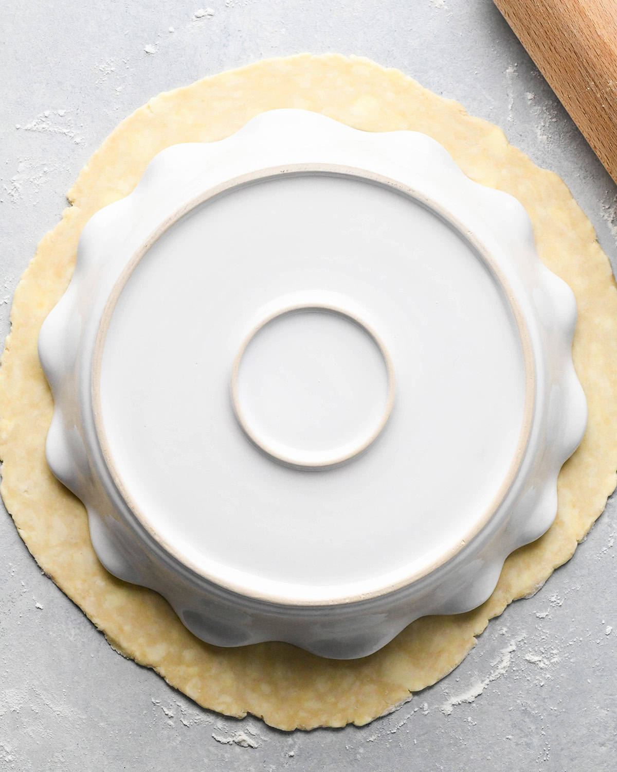 How to Make a Lattice Pie Crust - measuring the dough with a pie dish