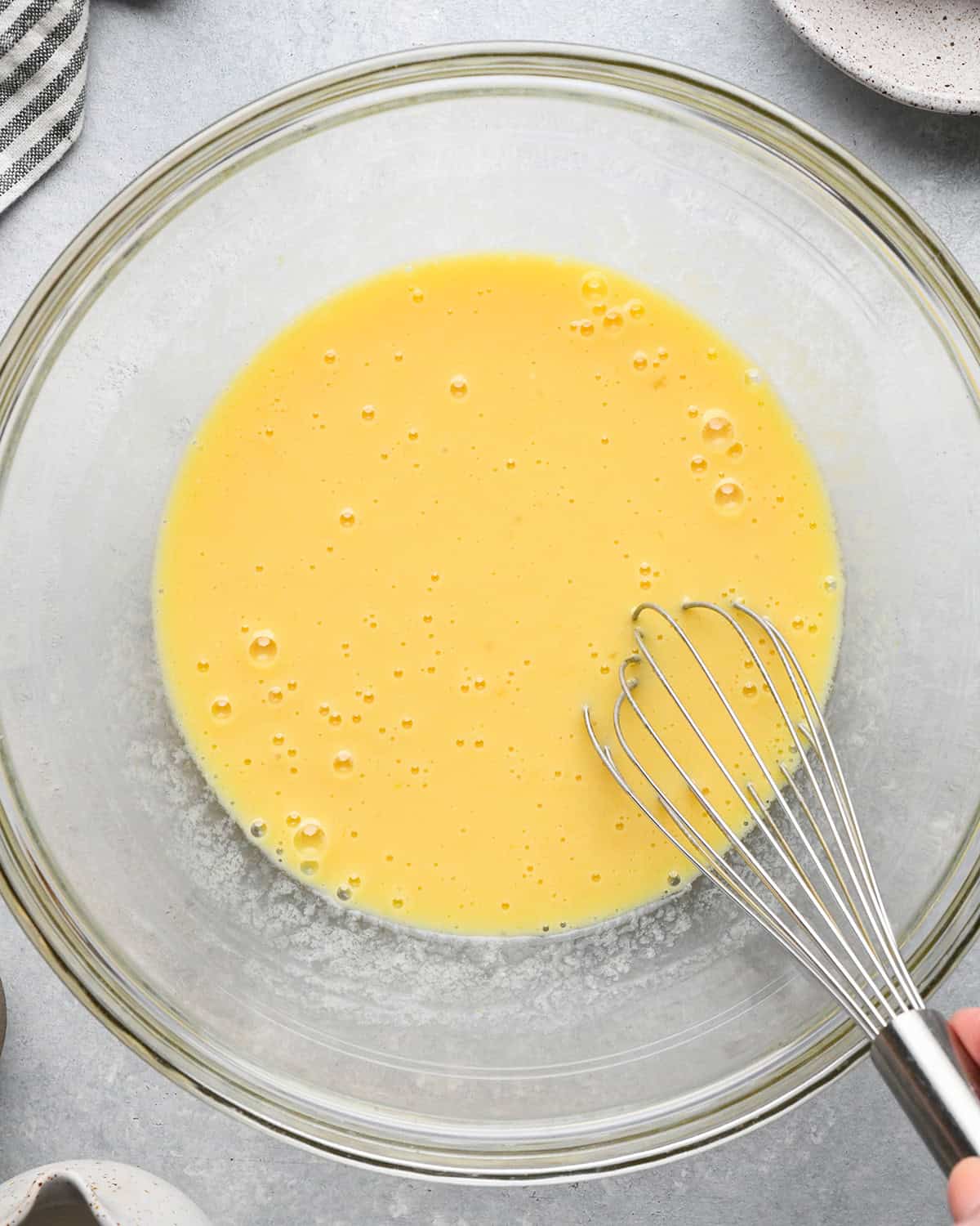 How to Make Oat Flour Pancakes wet ingredients whisked together in a bowl