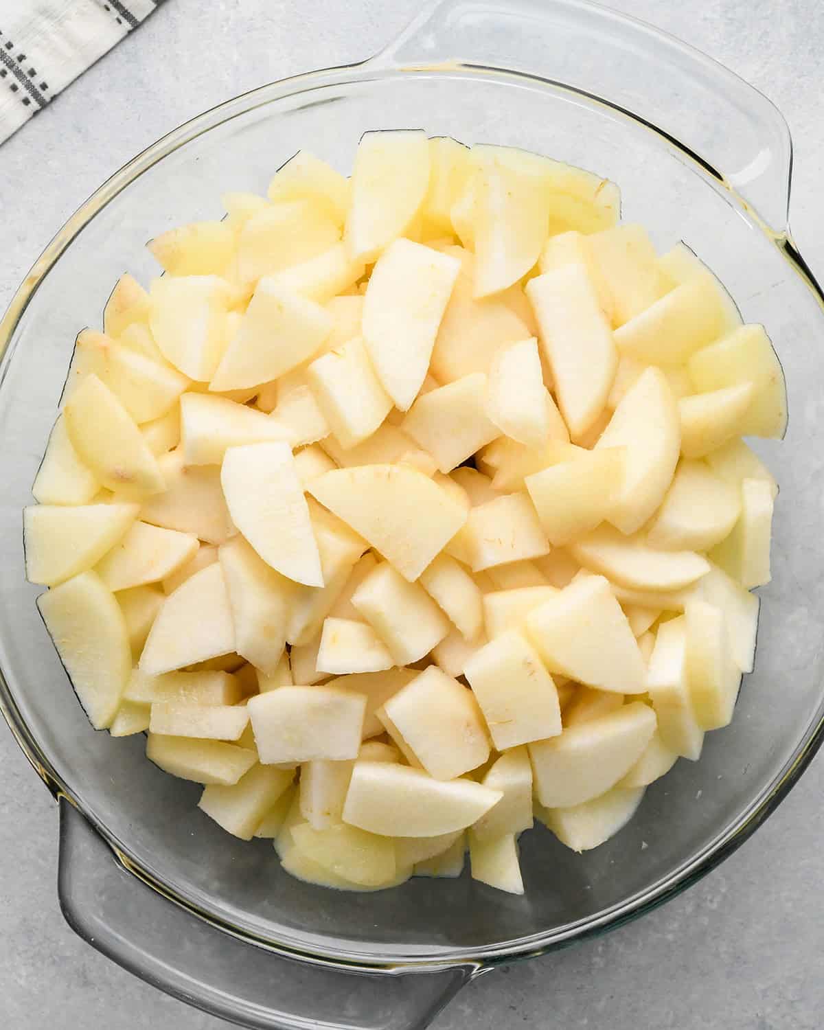 How to Make Pear Pie - sliced pears in a glass bowl after cooking