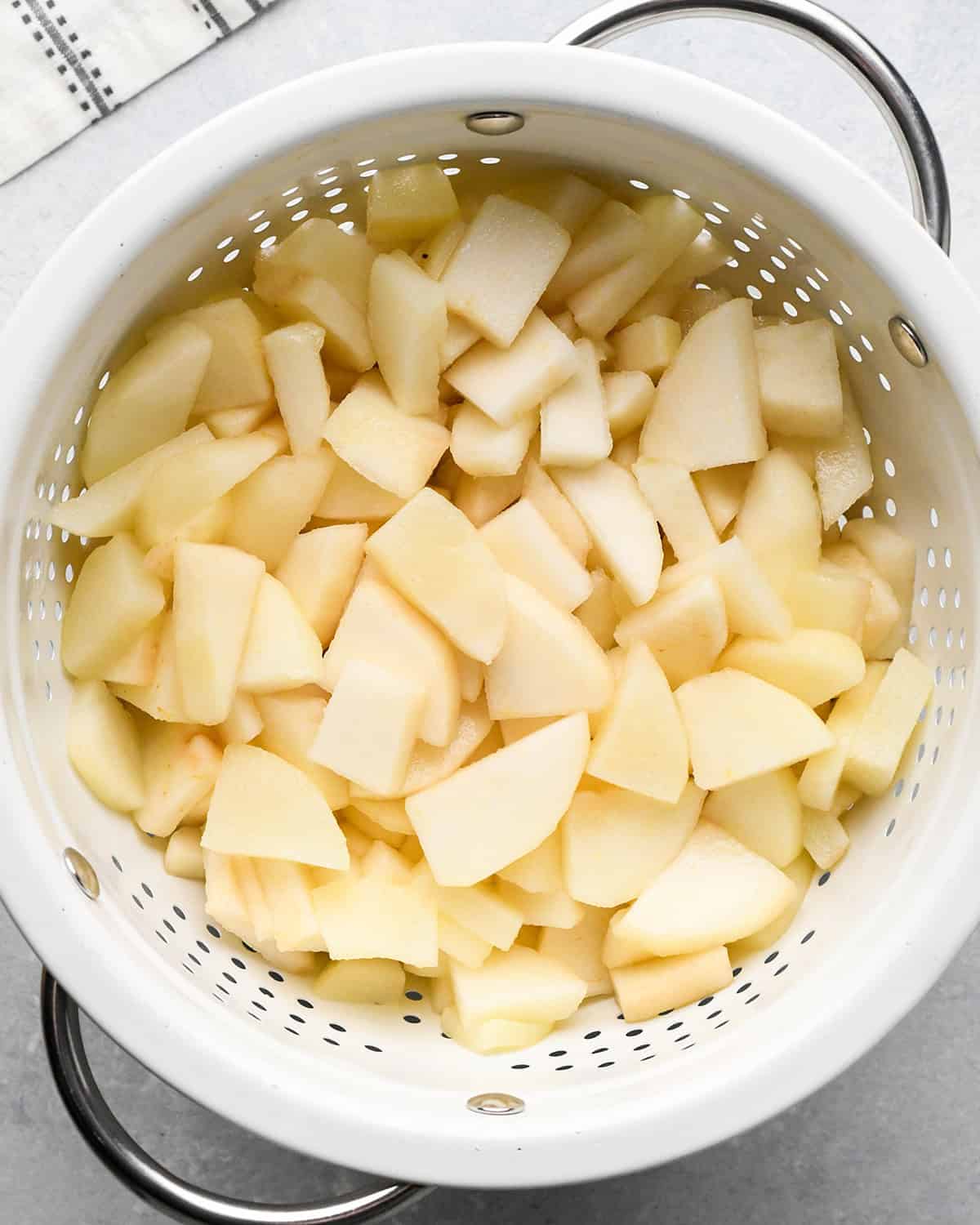 How to Make Pear Pie - sliced pears in a colander after cooking