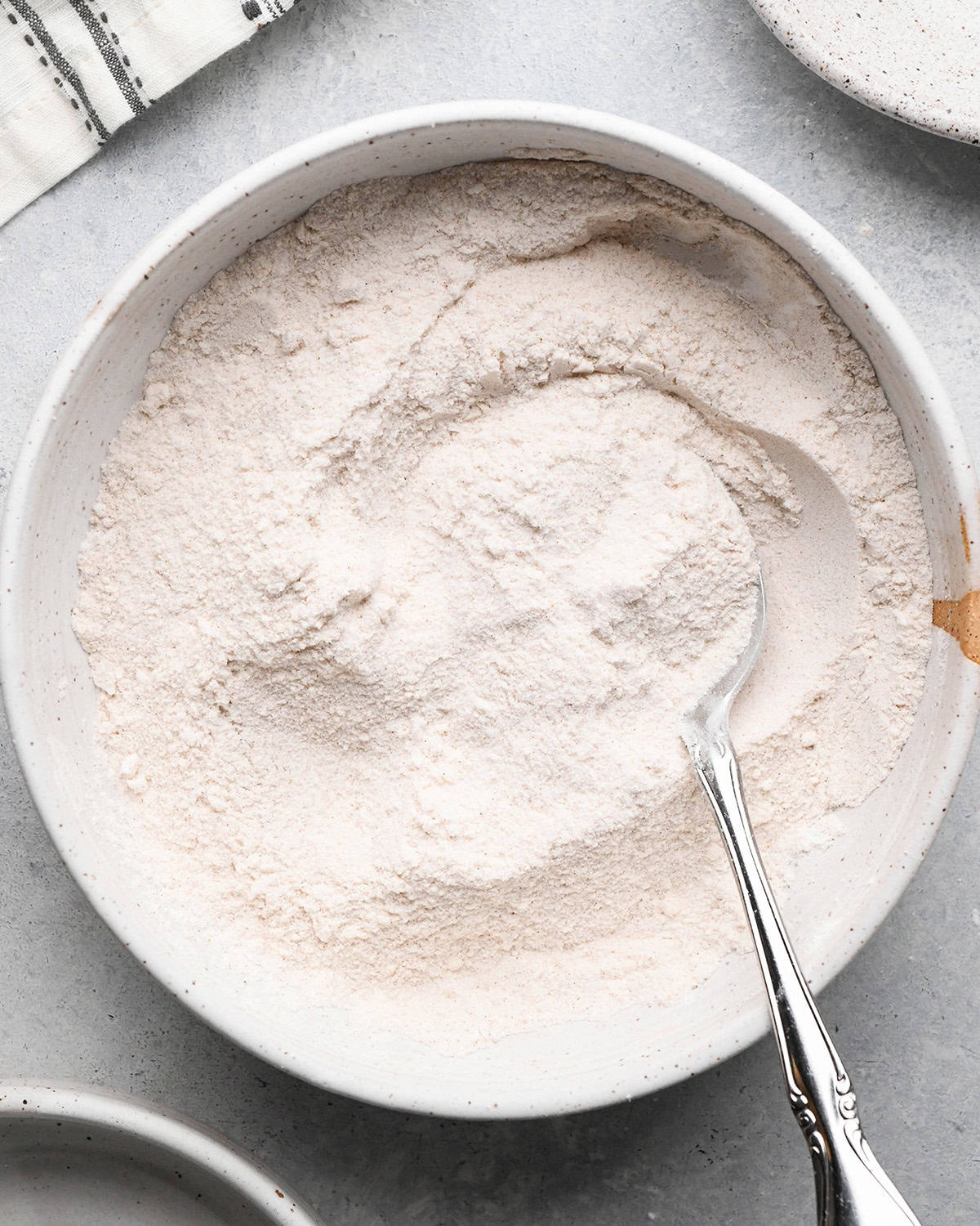 How to Make Pear Pie - dry filling ingredients mixed in a bowl with a spoon