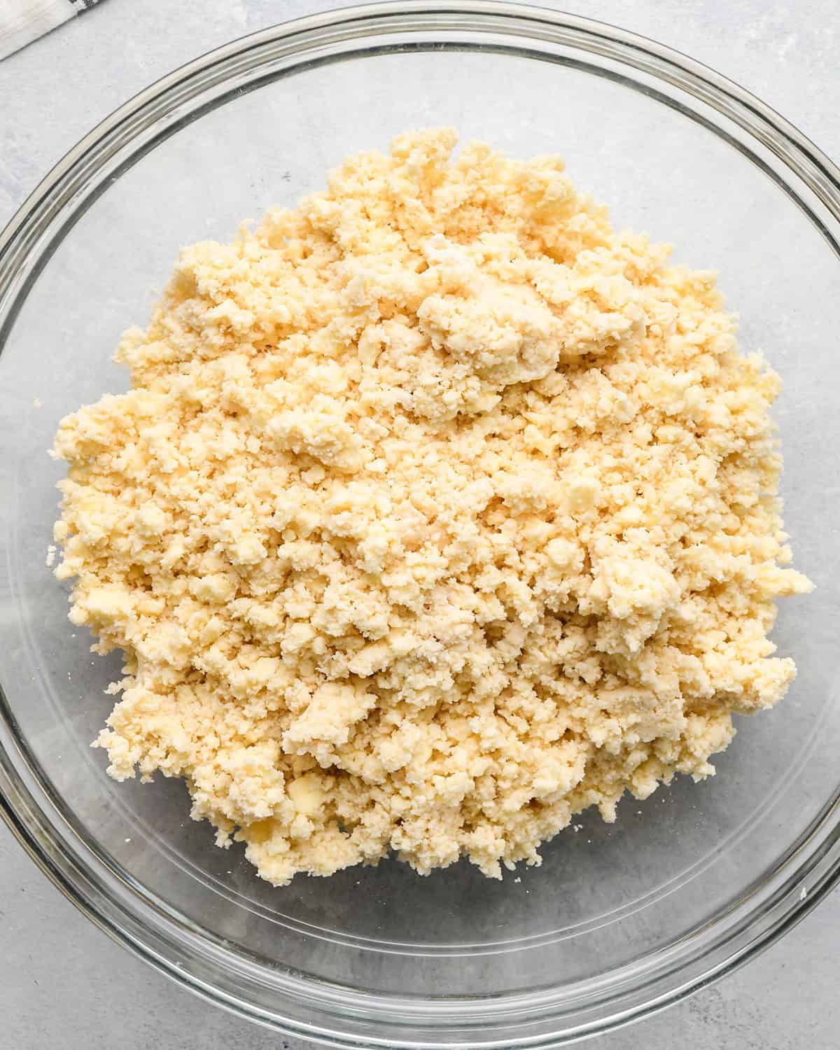 how to make a pear pie crust - dough in a bowl before forming a disc