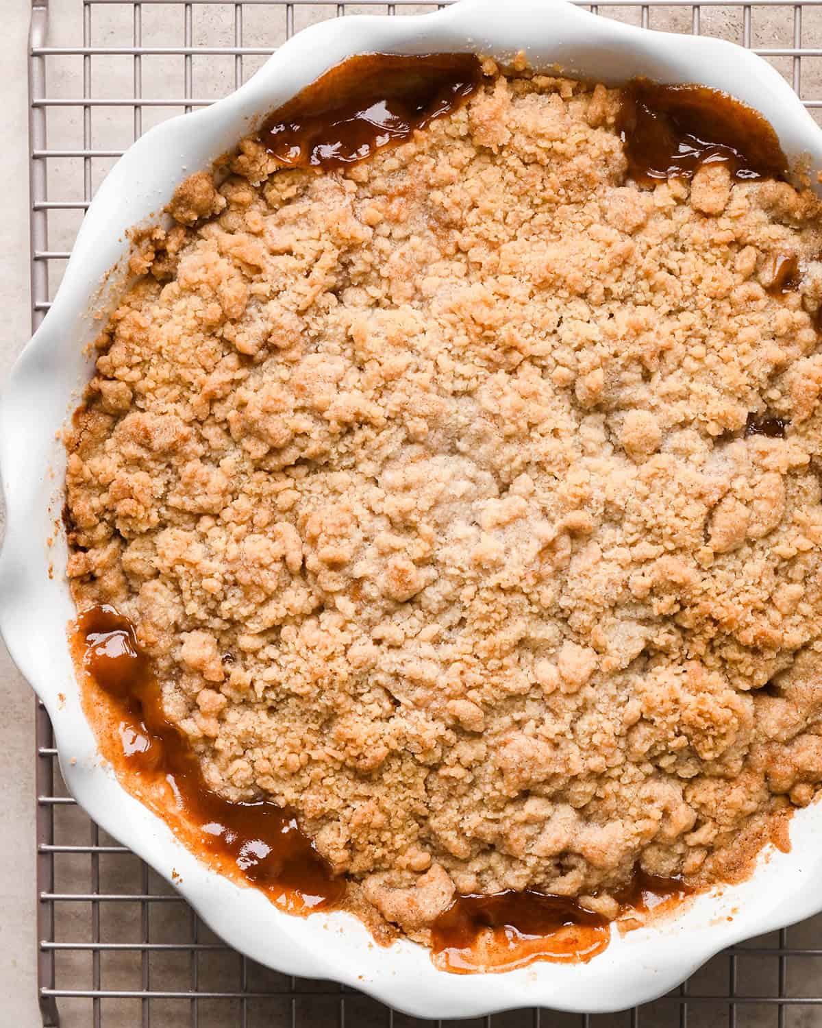 baked Pear Crumble in a pie dish on a wire cooling rack