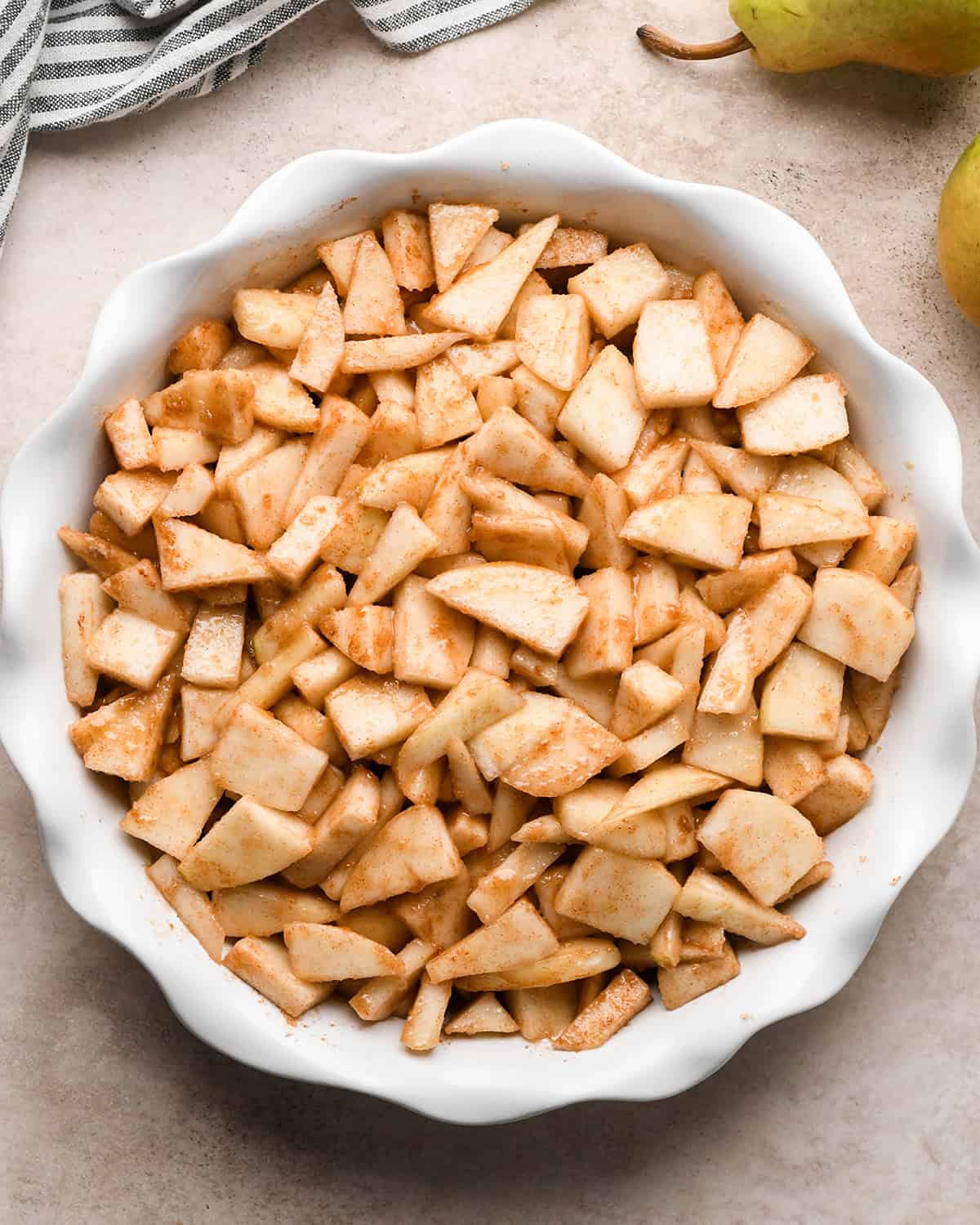 pear crumble filling in a pie dish