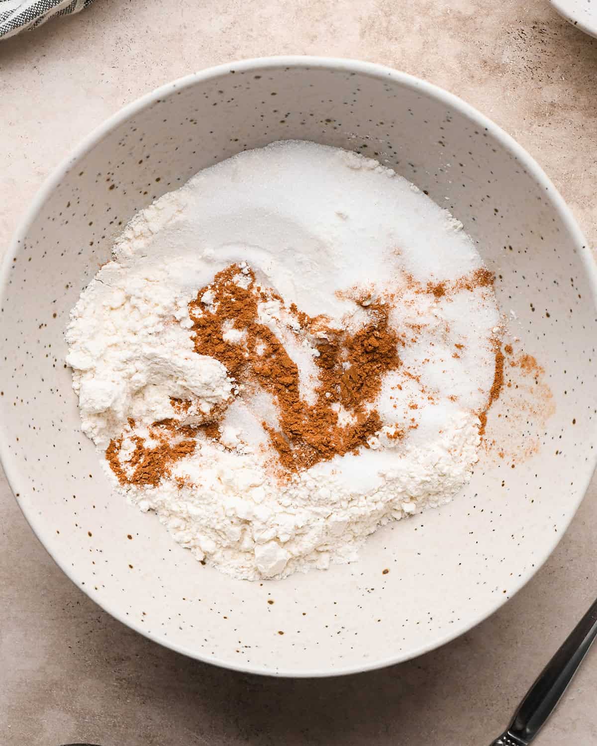 making Pear Crumble topping - dry ingredients in a bowl before mixing