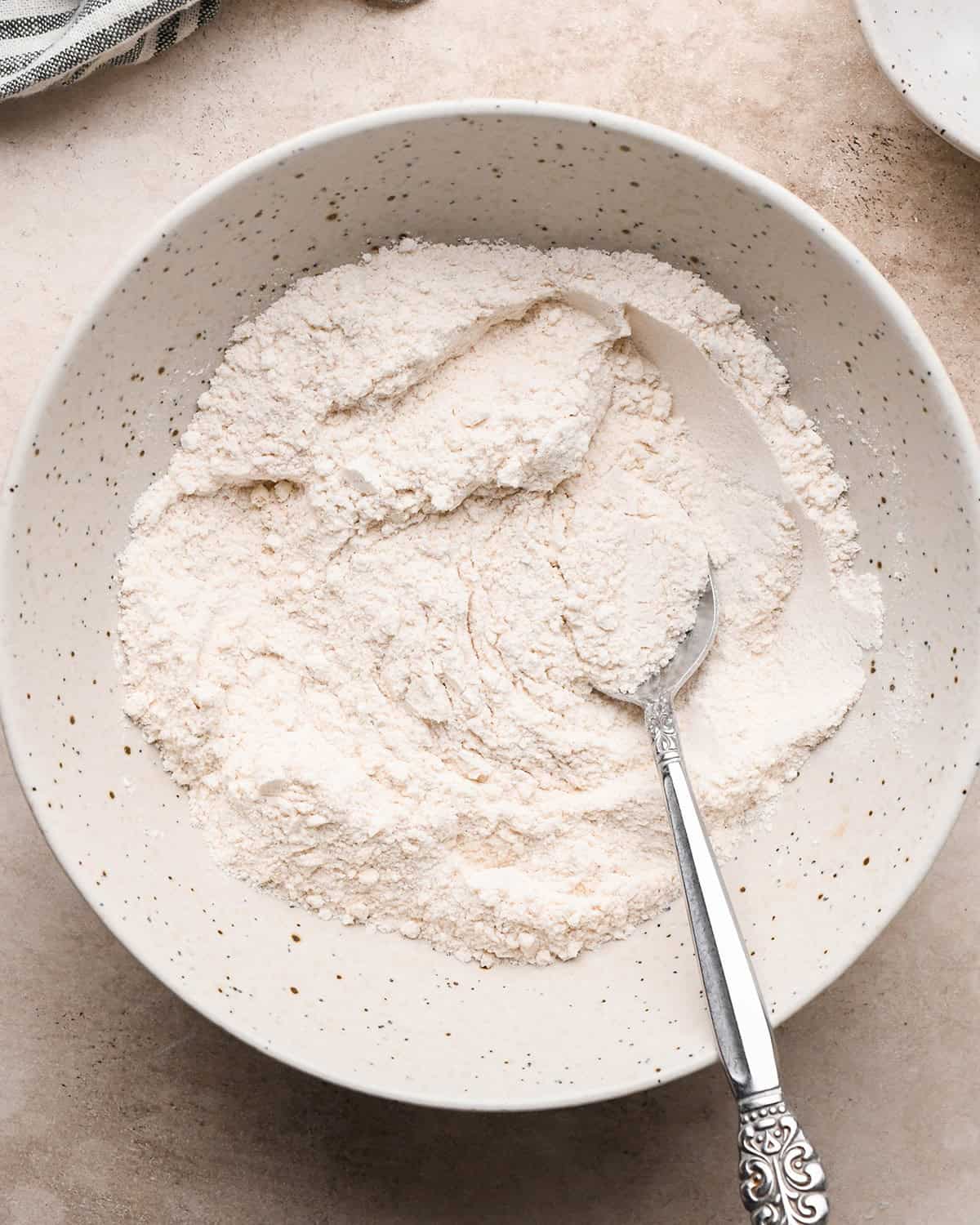 making Pear Crumble topping - dry ingredients in a bowl after mixing