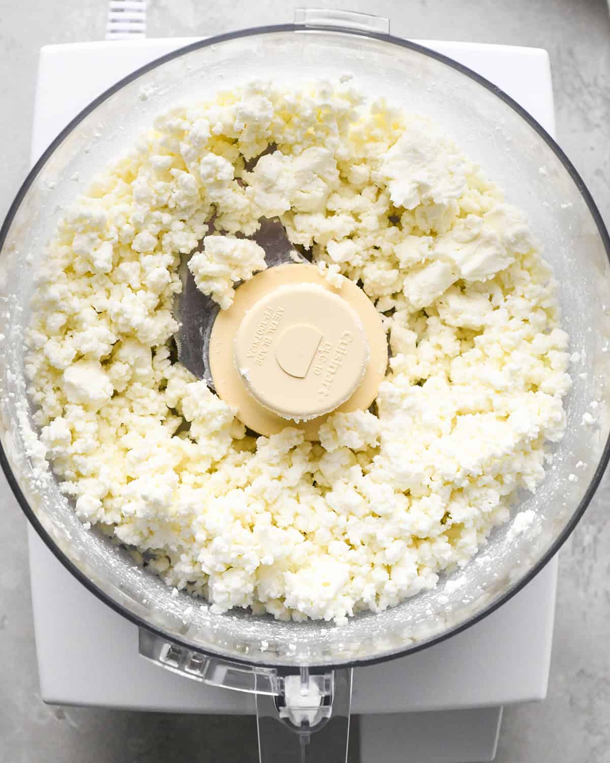 crumbled goat cheese in a food processor
