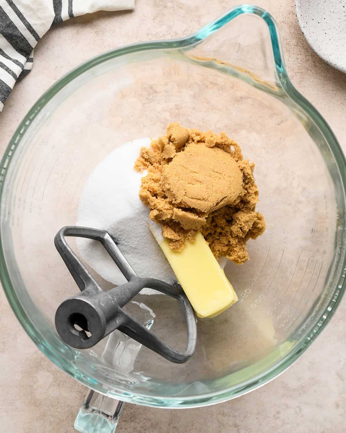 making pretzel cookies - butter, white sugar and brown sugar in a mixer before beating