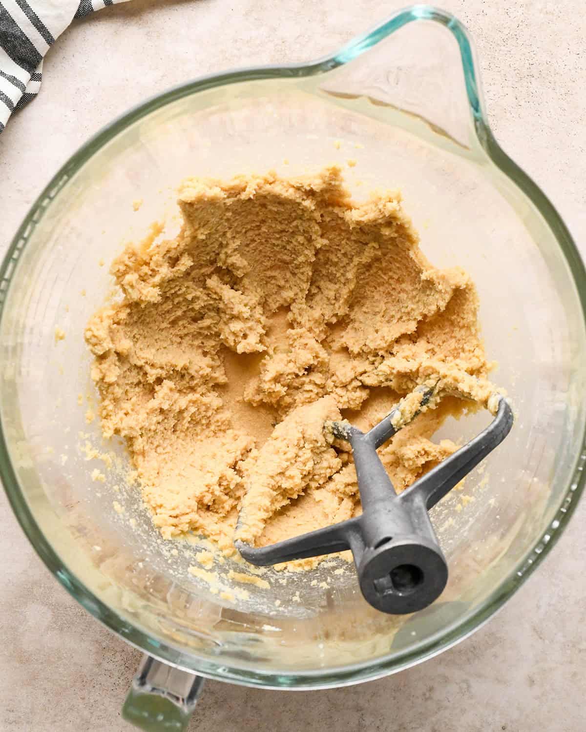 making pretzel cookies - butter and sugars beaten in a bowl with a beater