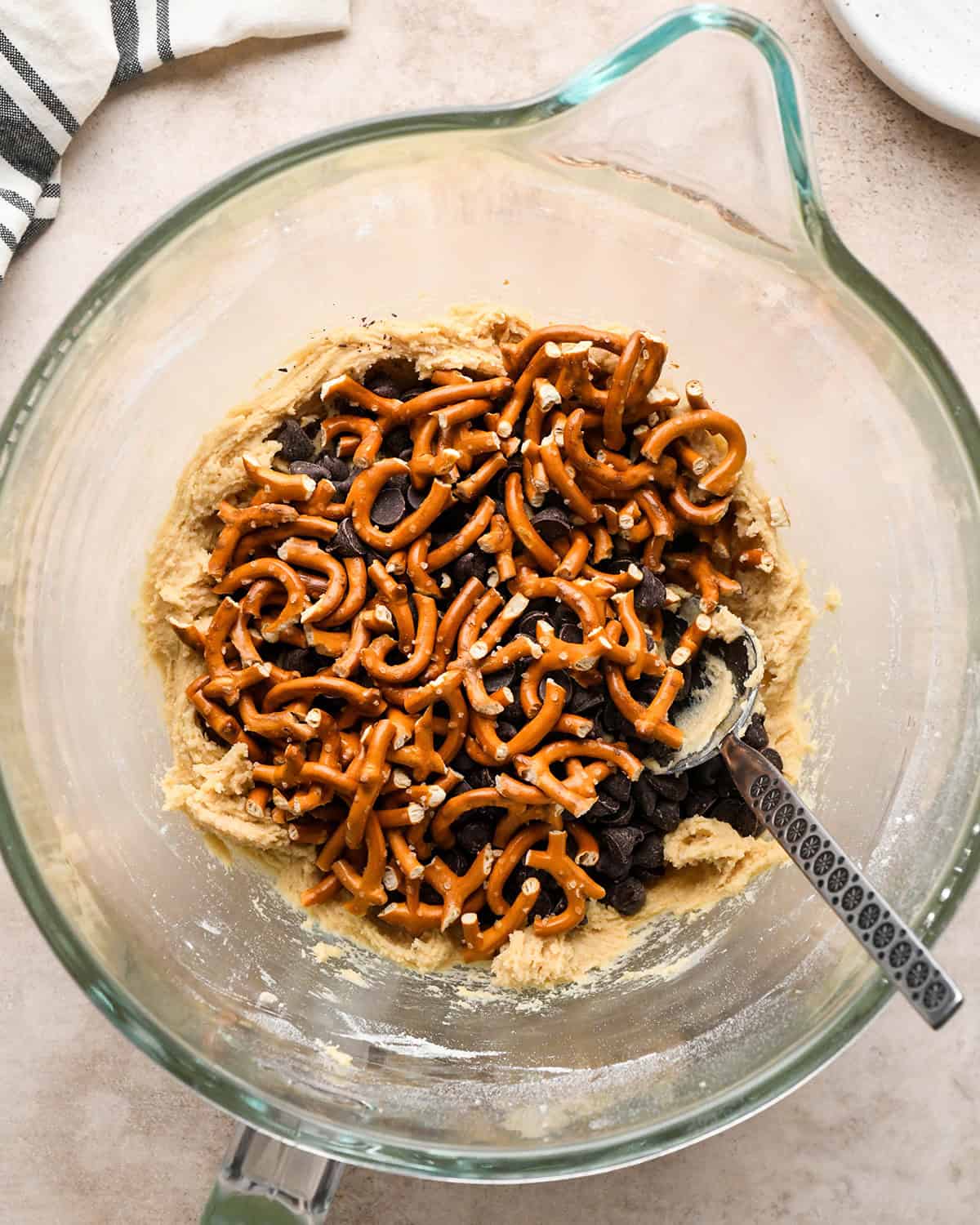 making pretzel cookies - pretzels and chocolate chips added before stirring