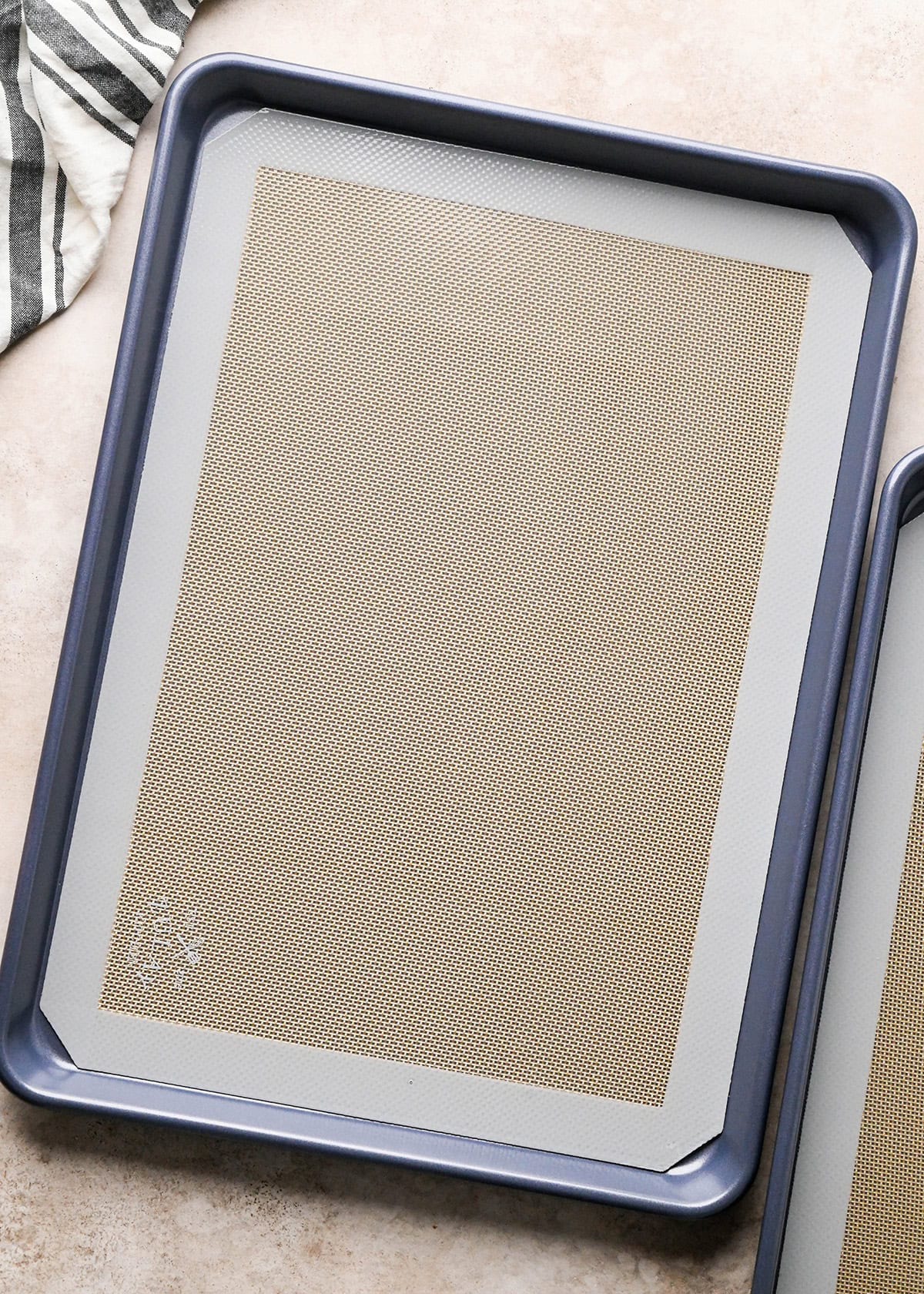 two baking sheets lined with silicone baking mats