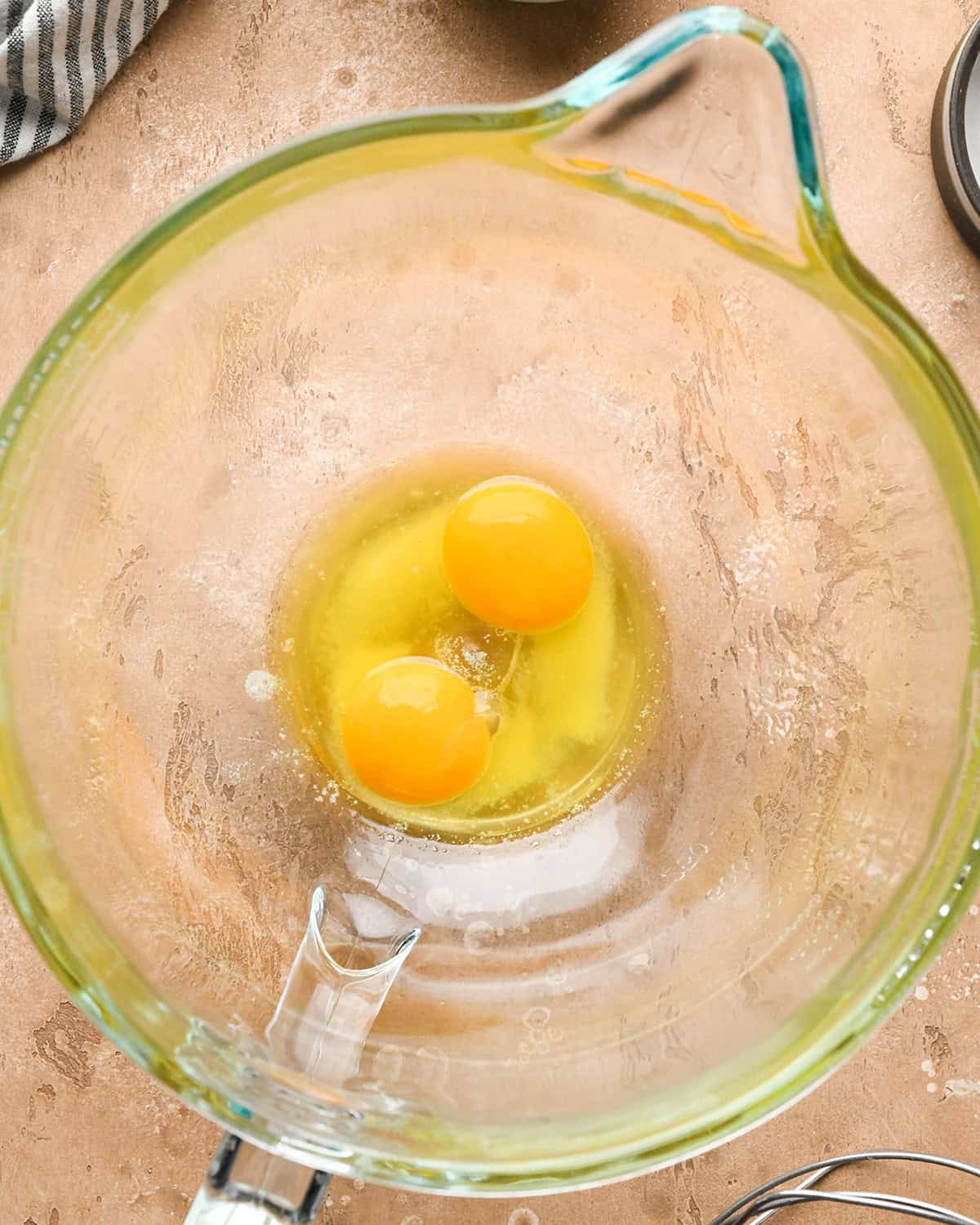 making chocolate chip waffles - two egg yolks and butter in a mixing bowl before mixing
