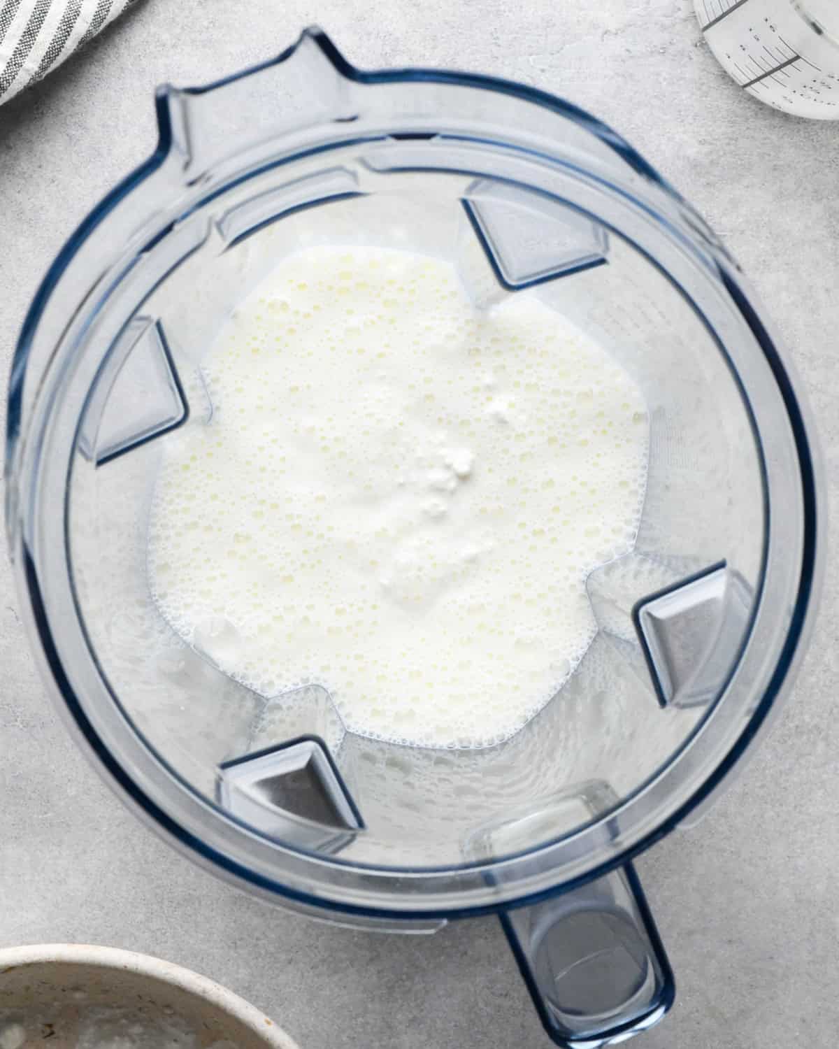 milk and cottage cheese in a blending container before blending making macaroni and cottage cheese