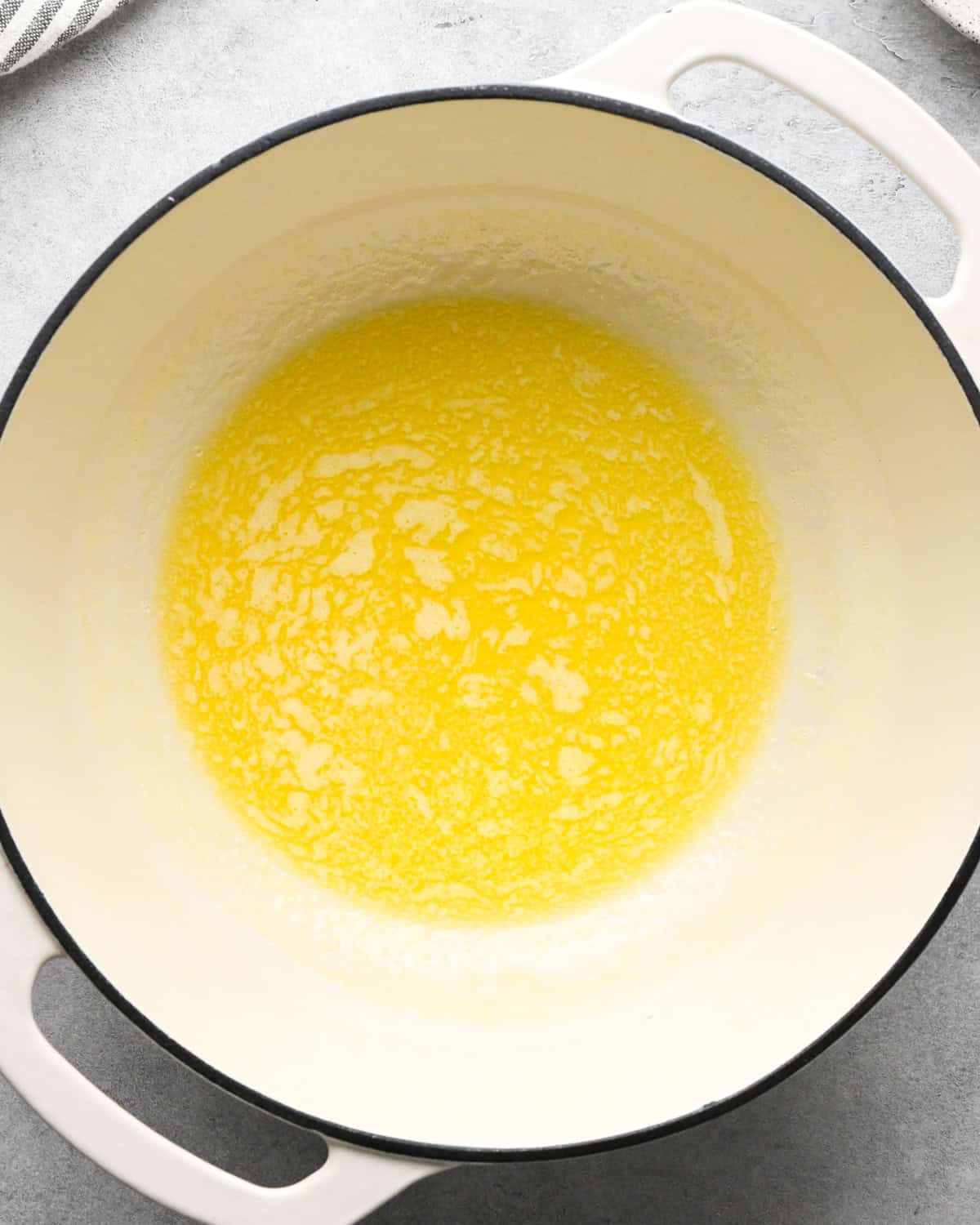 melted butter in a white saucepan making cottage cheese macaroni and cheese