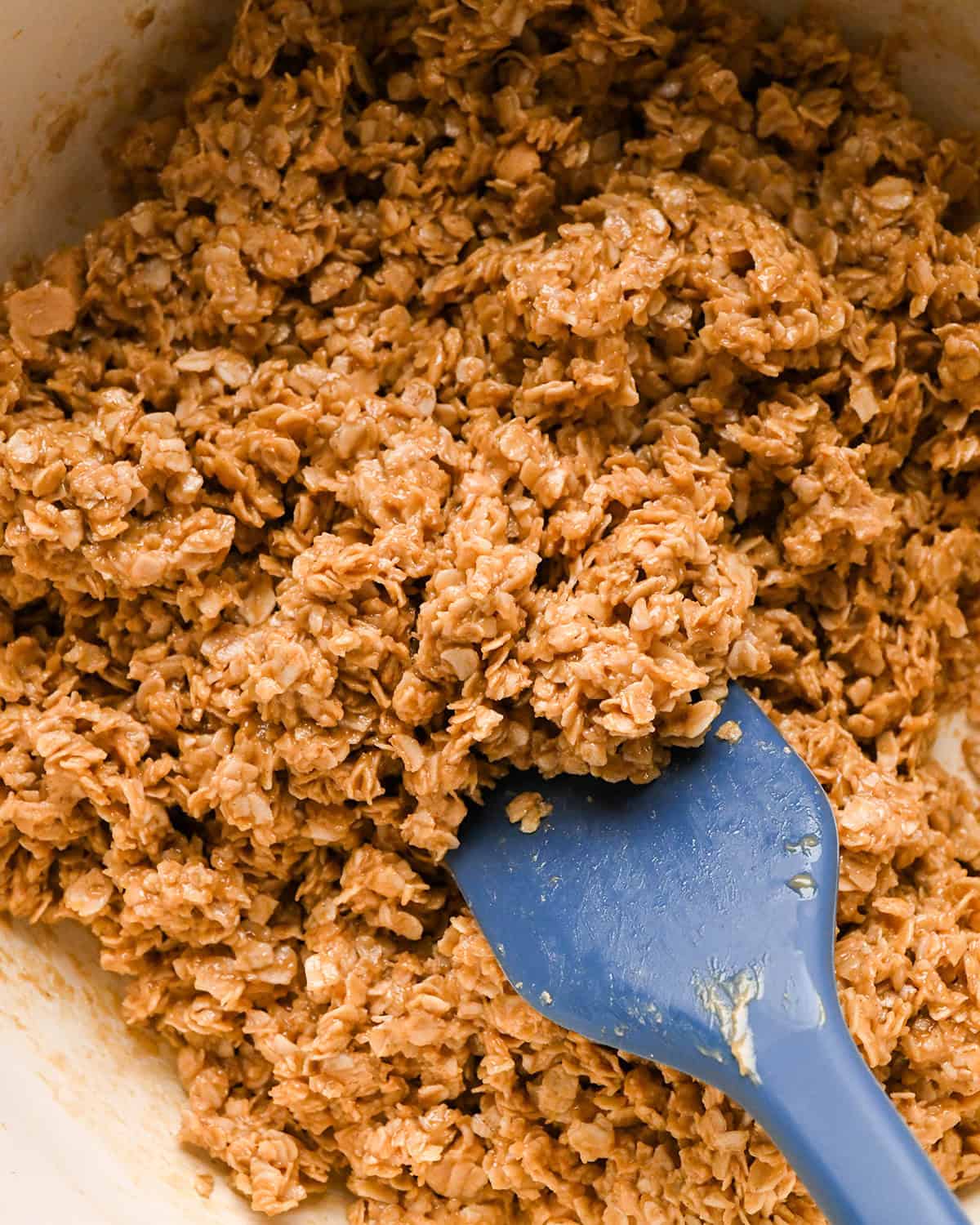 making Peanut Butter Granola Bars - final mixture in a pot with a spatula