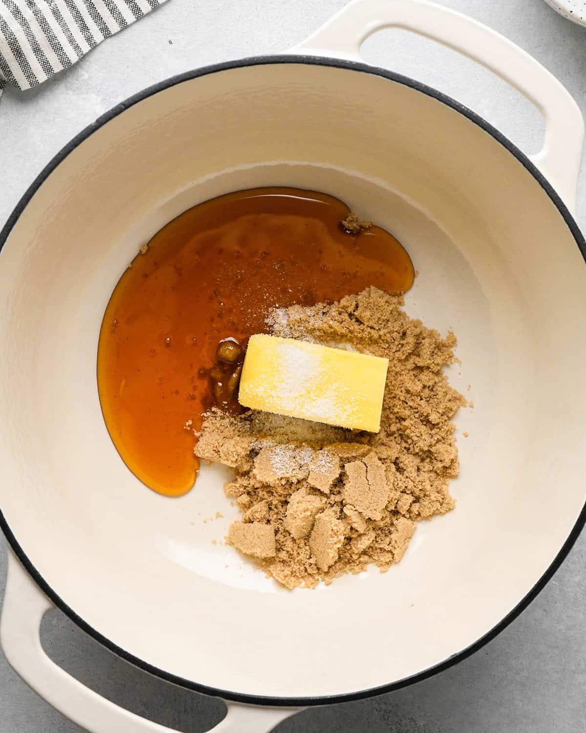 making Peanut Butter Granola Bars - butter, honey, brown sugar and salt in a pot before melting