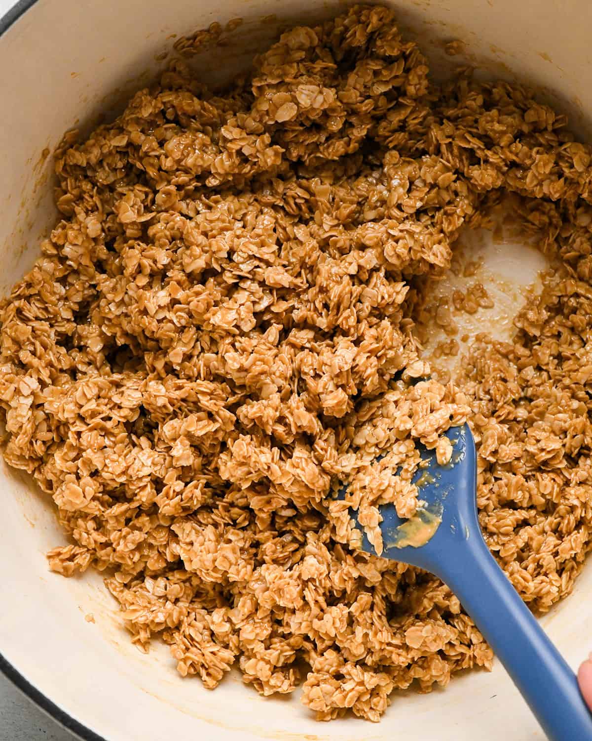 Peanut Butter Granola Bars mixture in a pot with a spatula