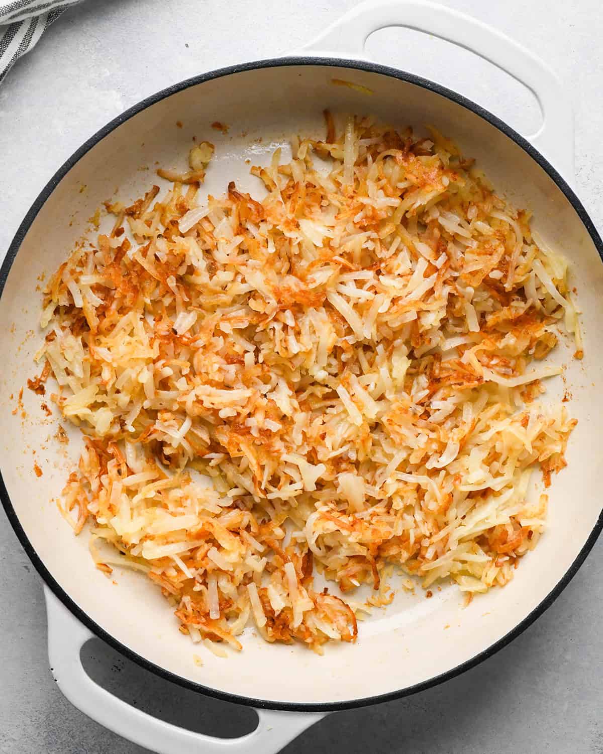 browned hash browns in a skillet