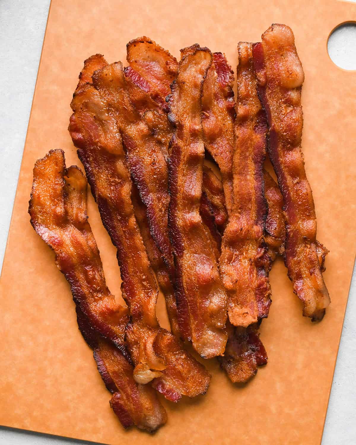How to Make Breakfast Burritos- bacon on a cutting board before cutting