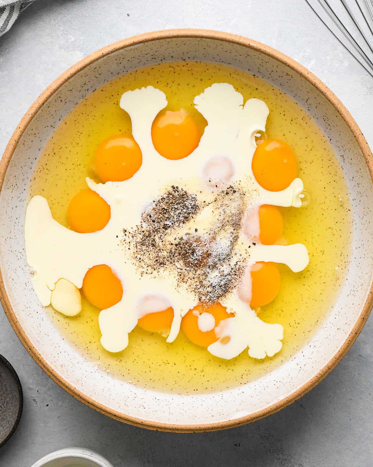 How to Make Breakfast Burritos - eggs ingredients in a bowl before whisking