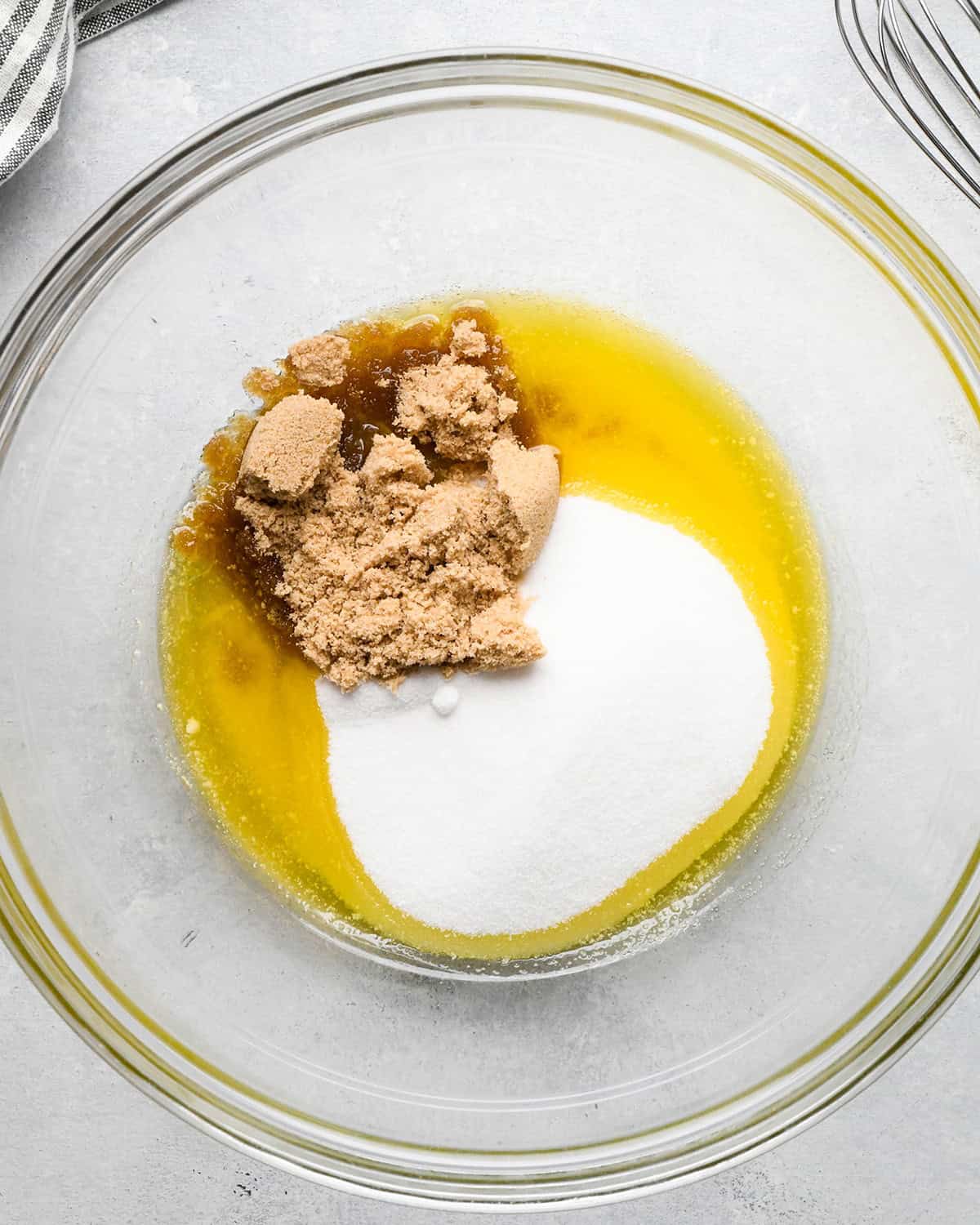 how to make Morning Glory Muffins - melted butter and sugars in a bowl before mixing