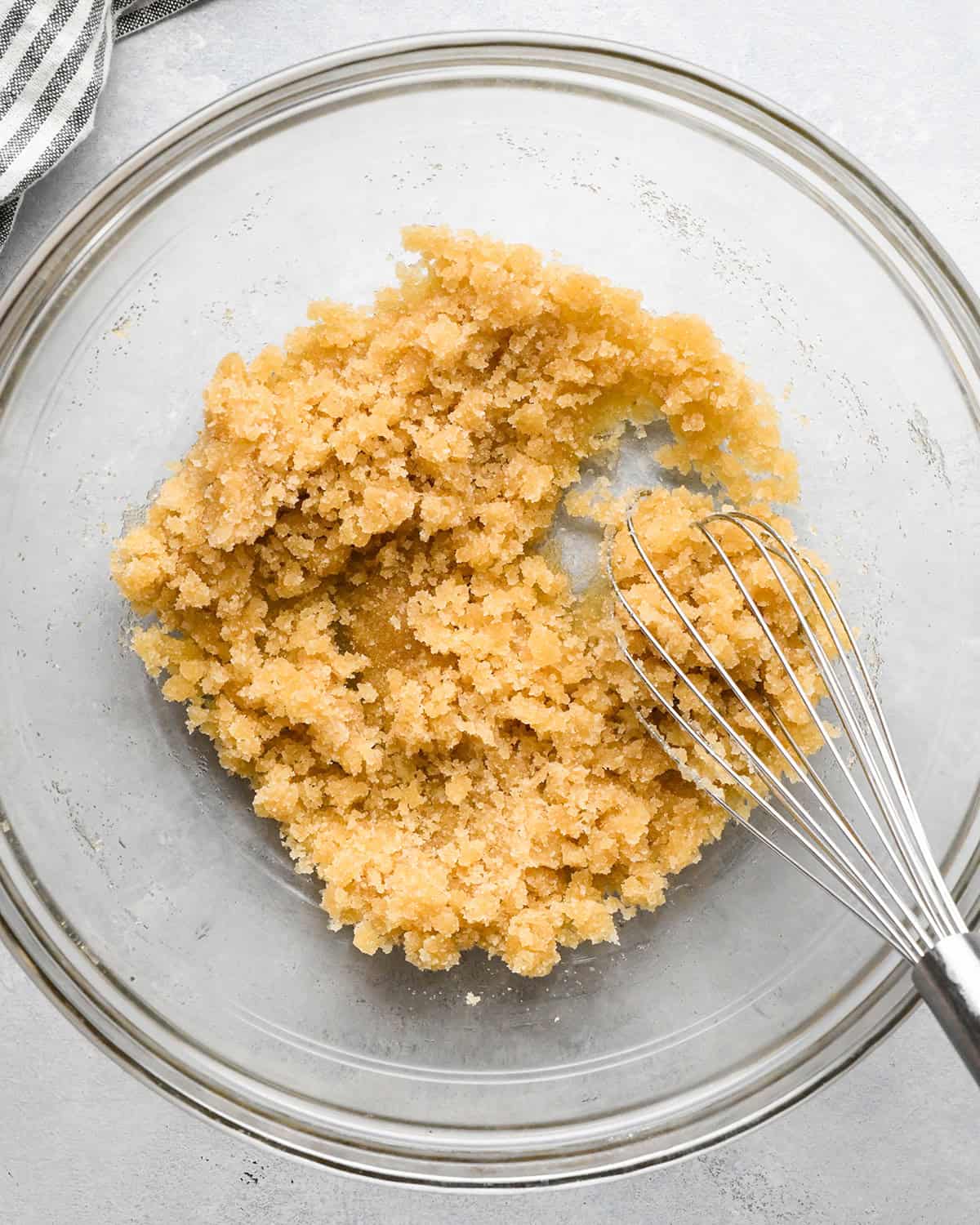 how to make Morning Glory Muffins - butter and sugar mixture mixed in a bowl