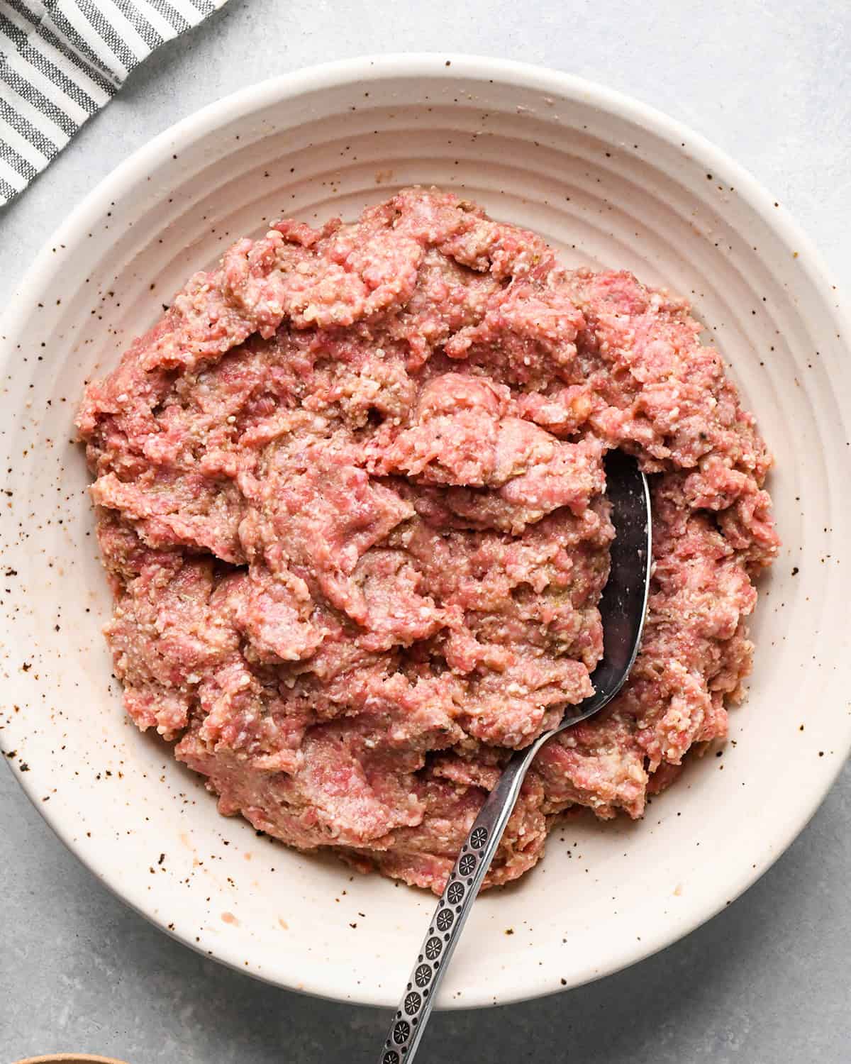 making slow cooker meatballs - meatball mixture in a bowl after mixing