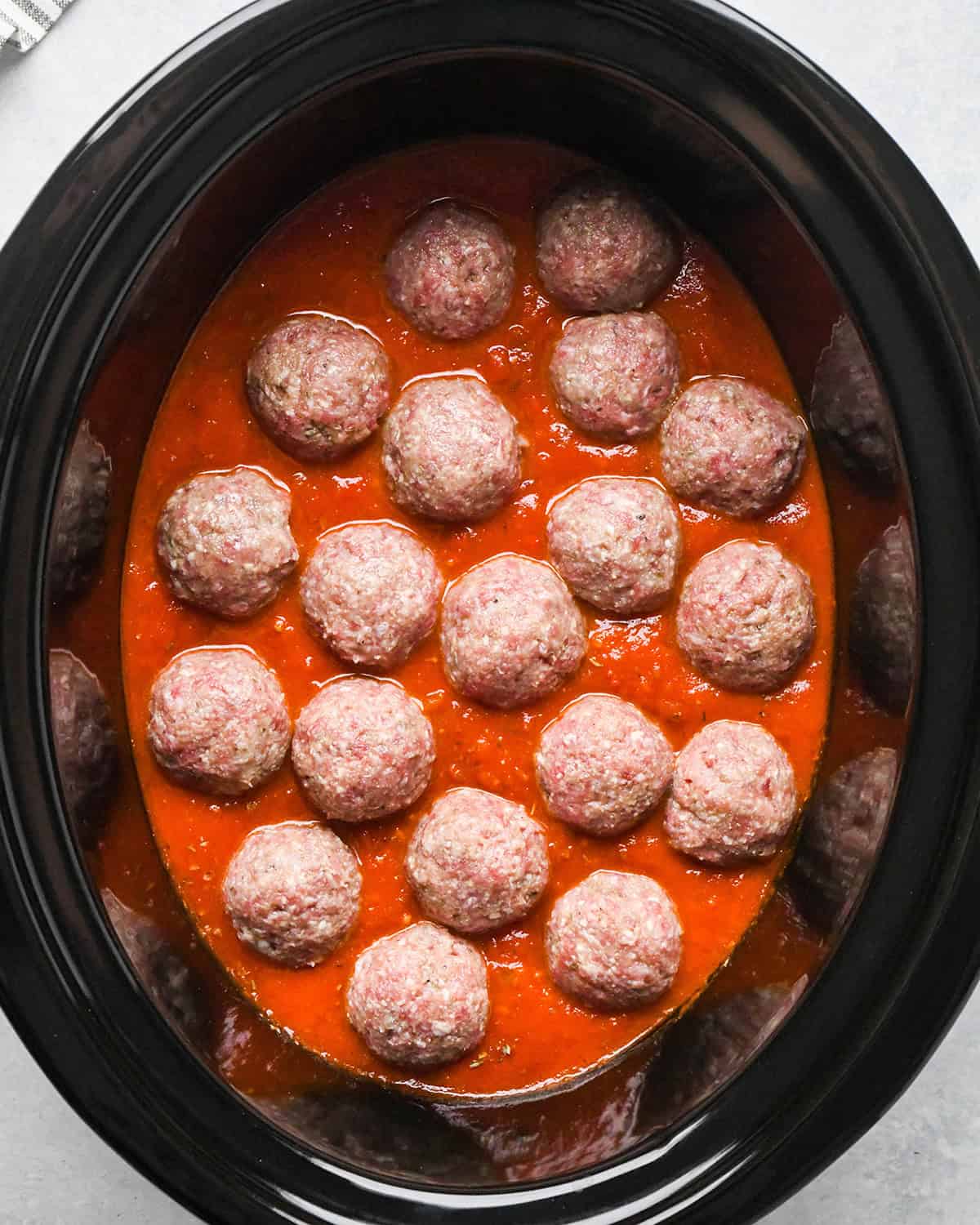 making slow cooker meatballs - ingredients in the slow cooker before cooking