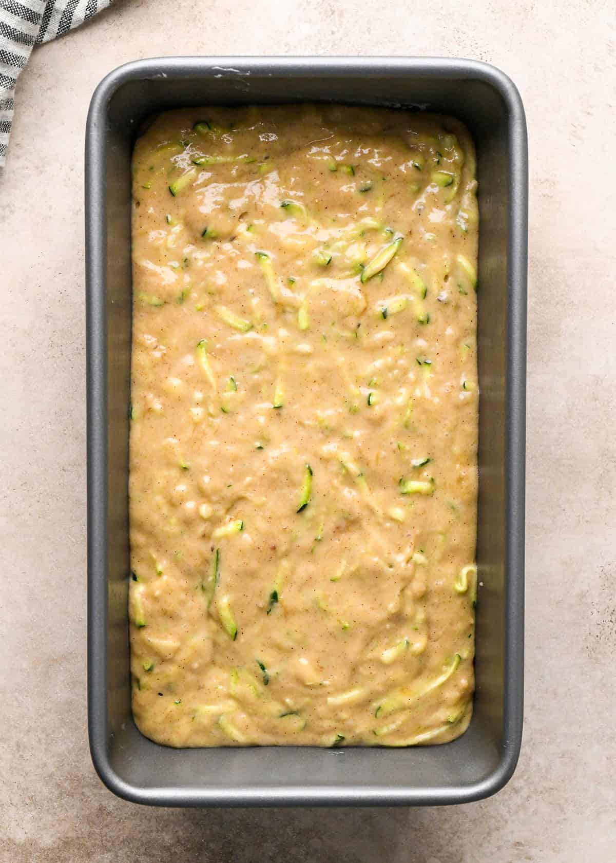zucchini banana bread in a loaf pan before baking