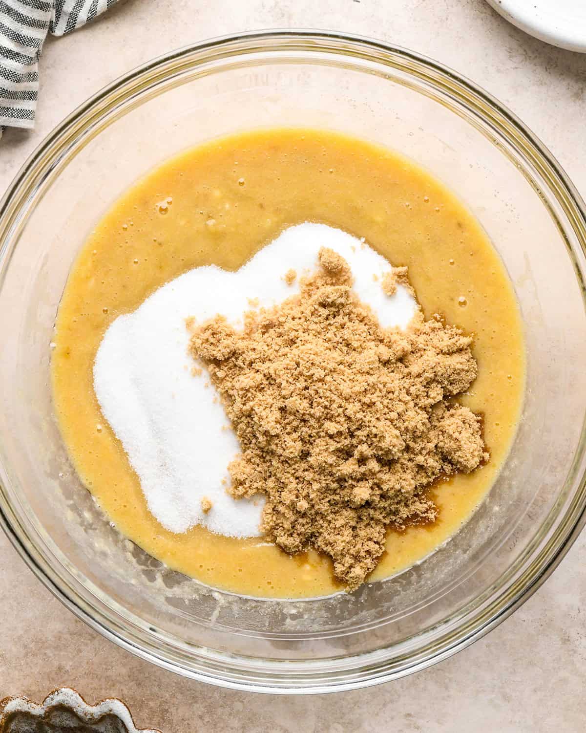 making zucchini banana bread - sugars added to wet ingredients before mixing