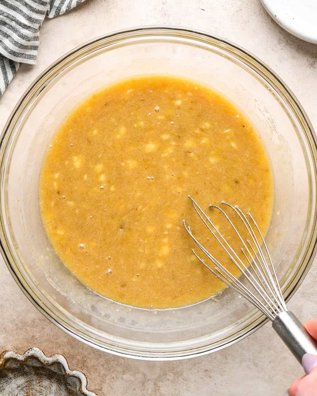 making zucchini banana bread - sugars whisked into wet ingredients