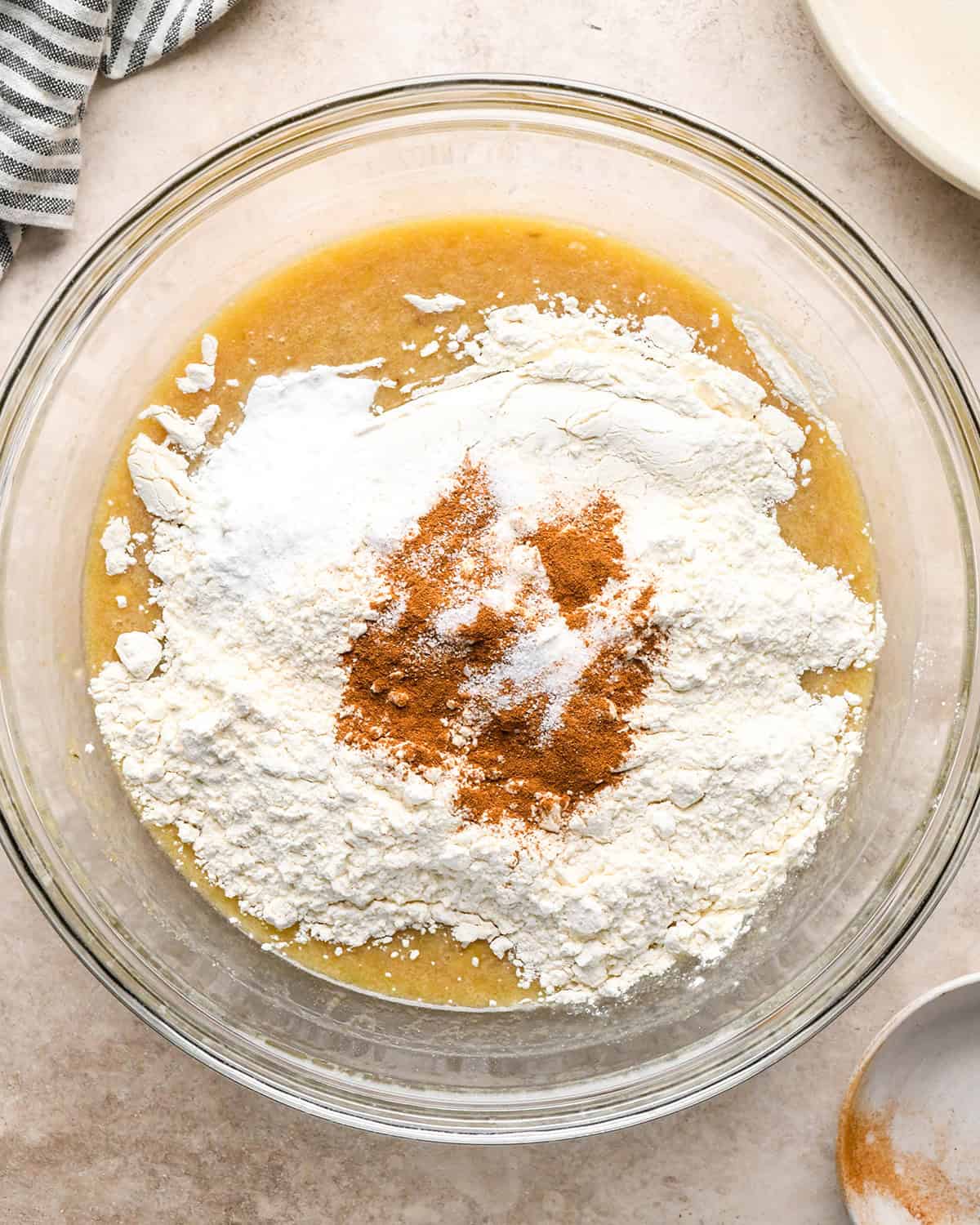 making zucchini banana bread - dry ingredients added to wet before mixing