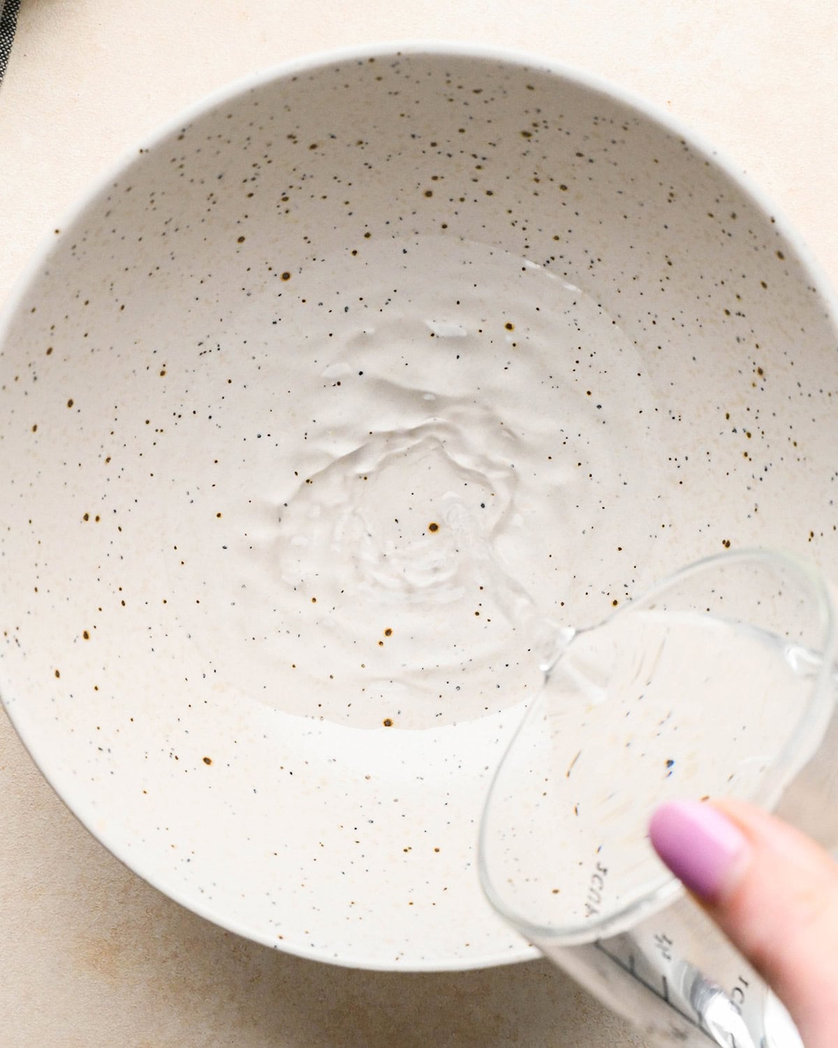making Apple Salad - water being poured into a bowl