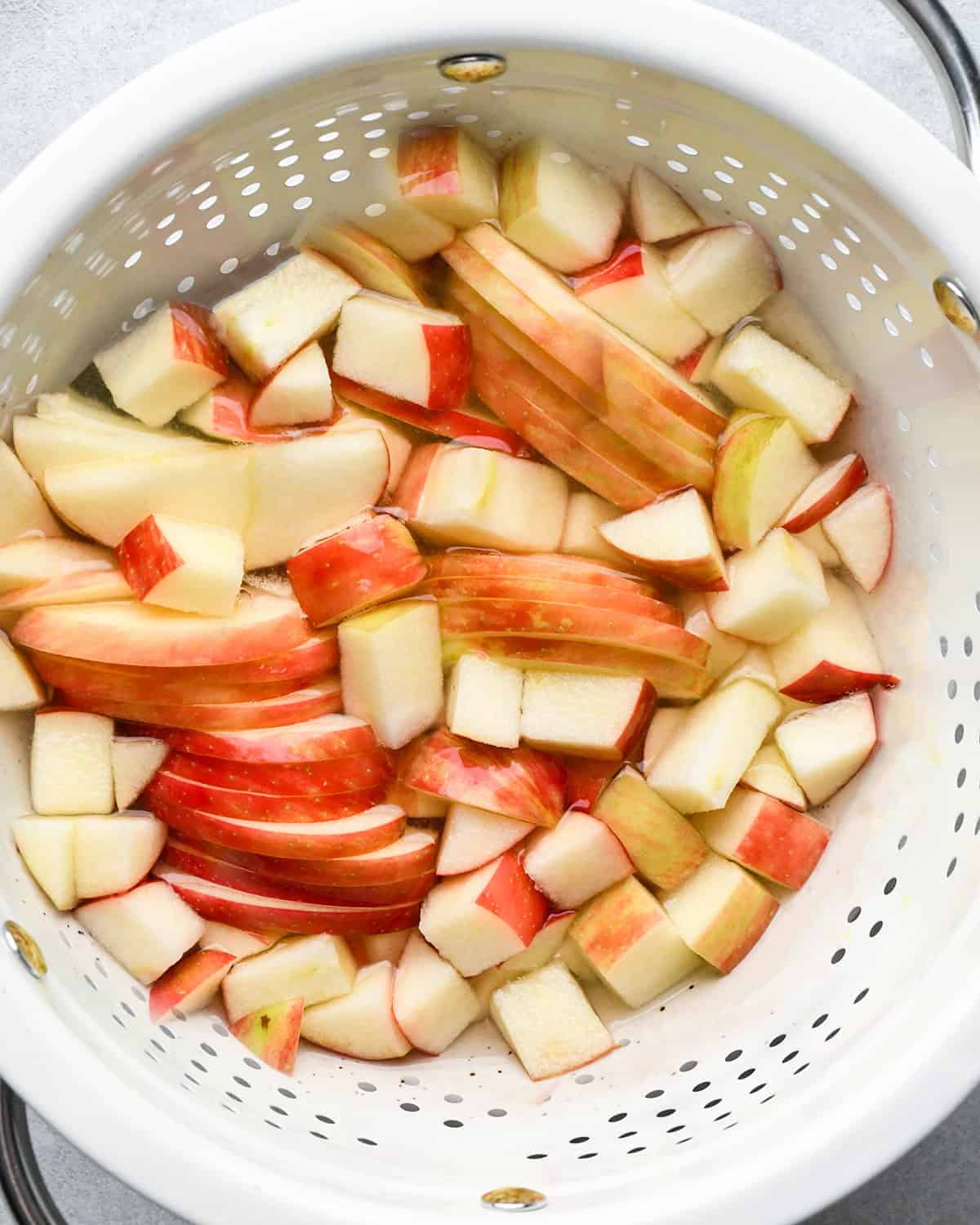 making Apple Salad - apple straining in a colander