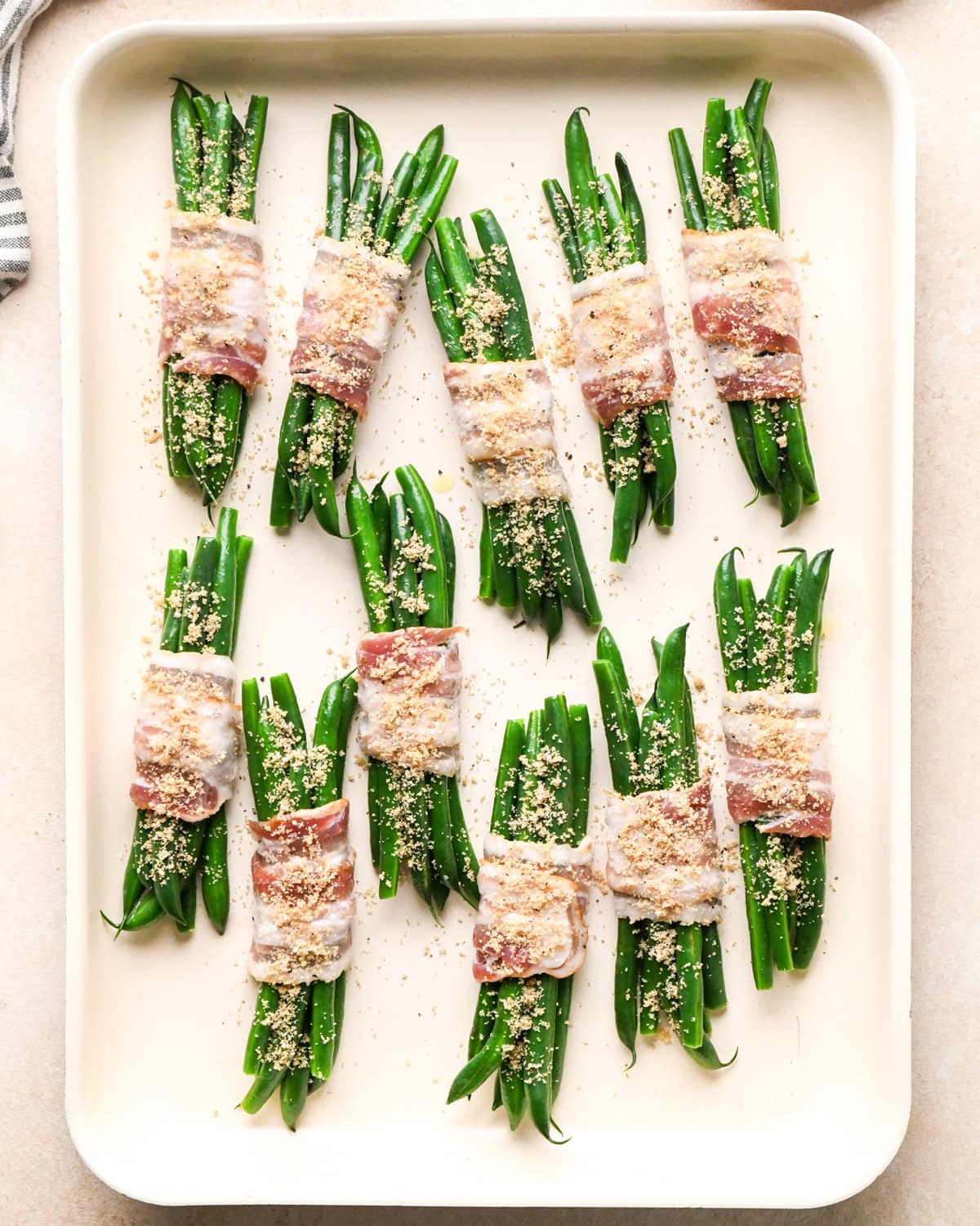Bacon Wrapped Green Beans on a baking sheet before baking