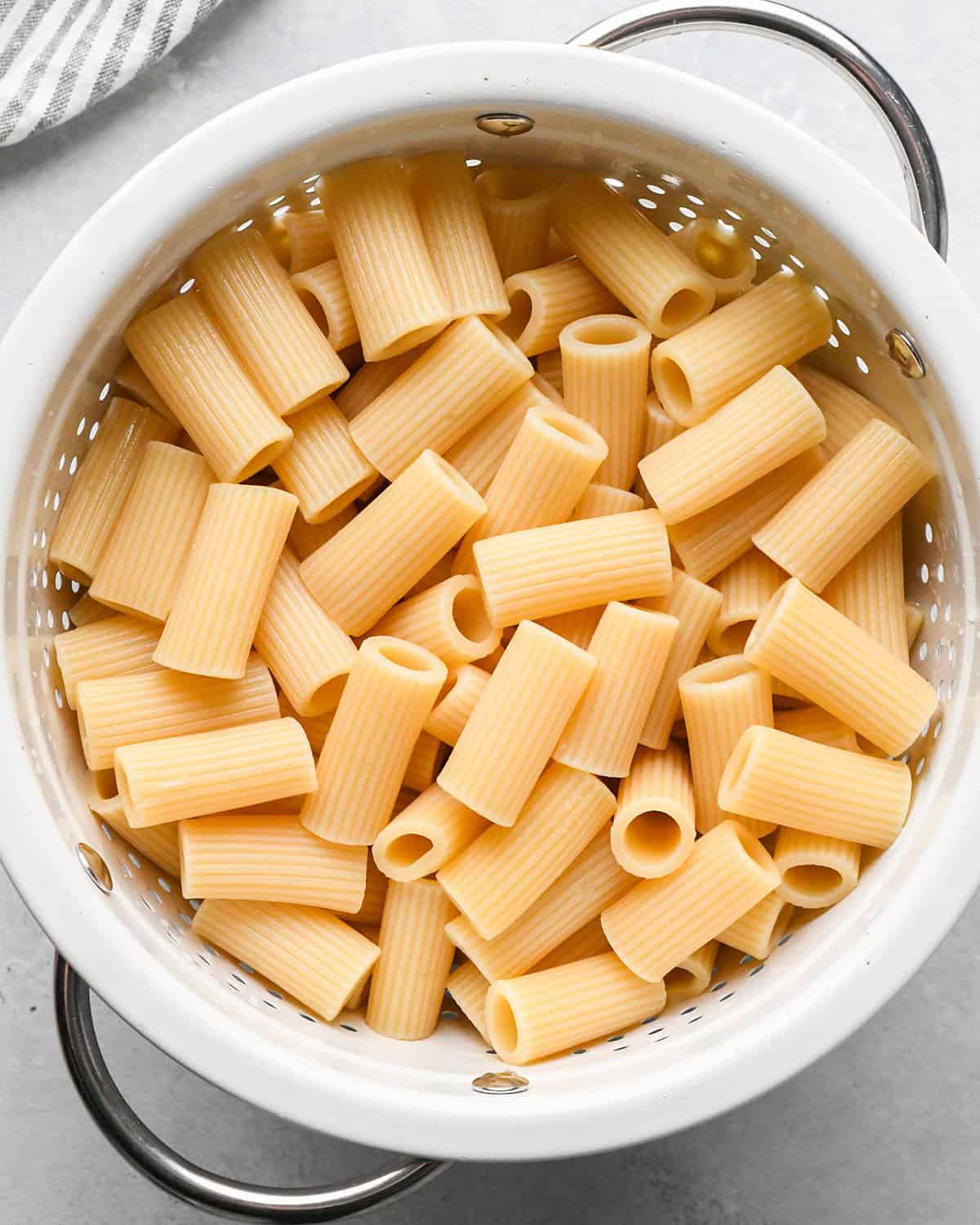 cooked Mostaccioli noodles in a colander 