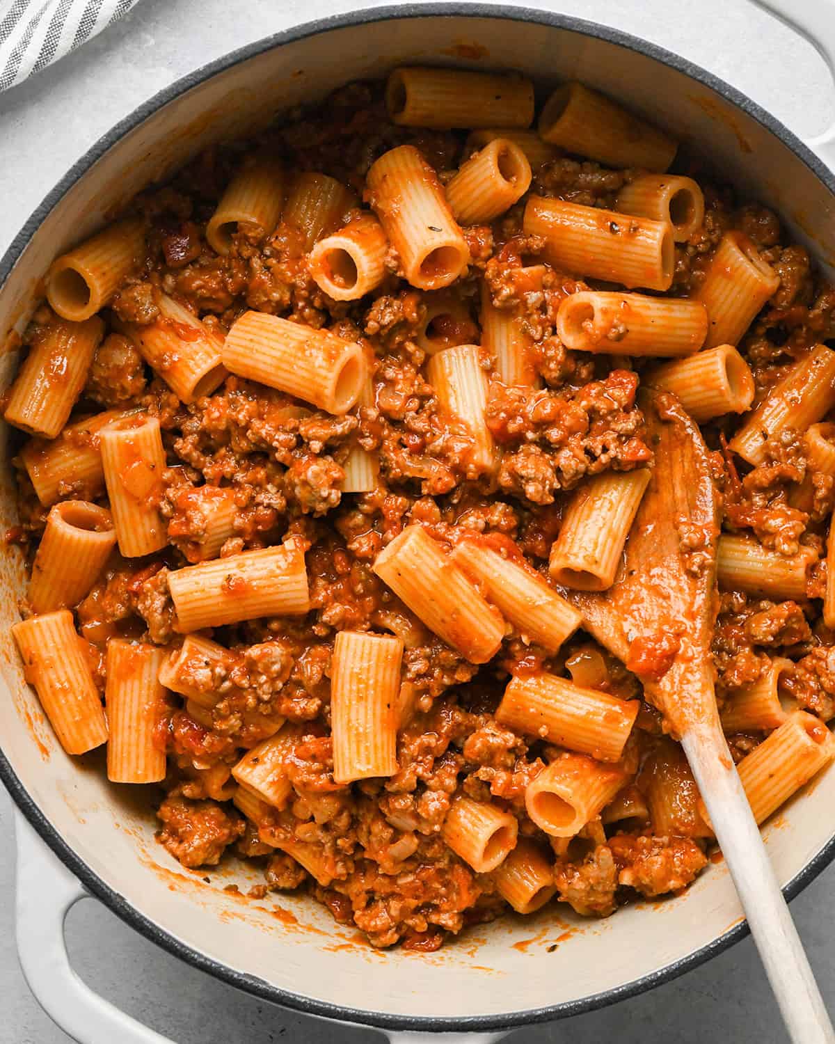 making Baked Mostaccioli - sauce and noodles combined in a pot 