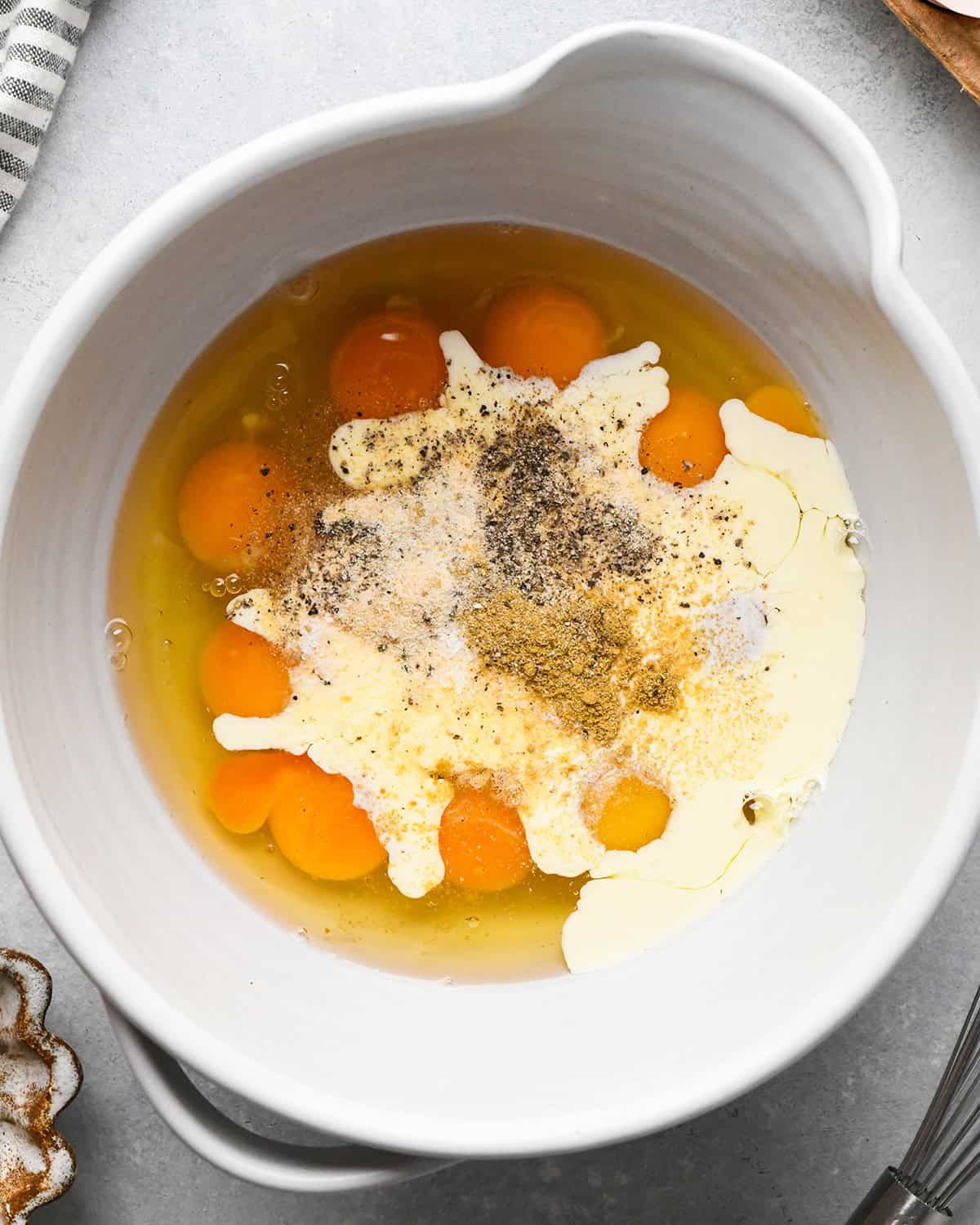 making breakfast tacos - eggs ingredients in a bowl before mixing