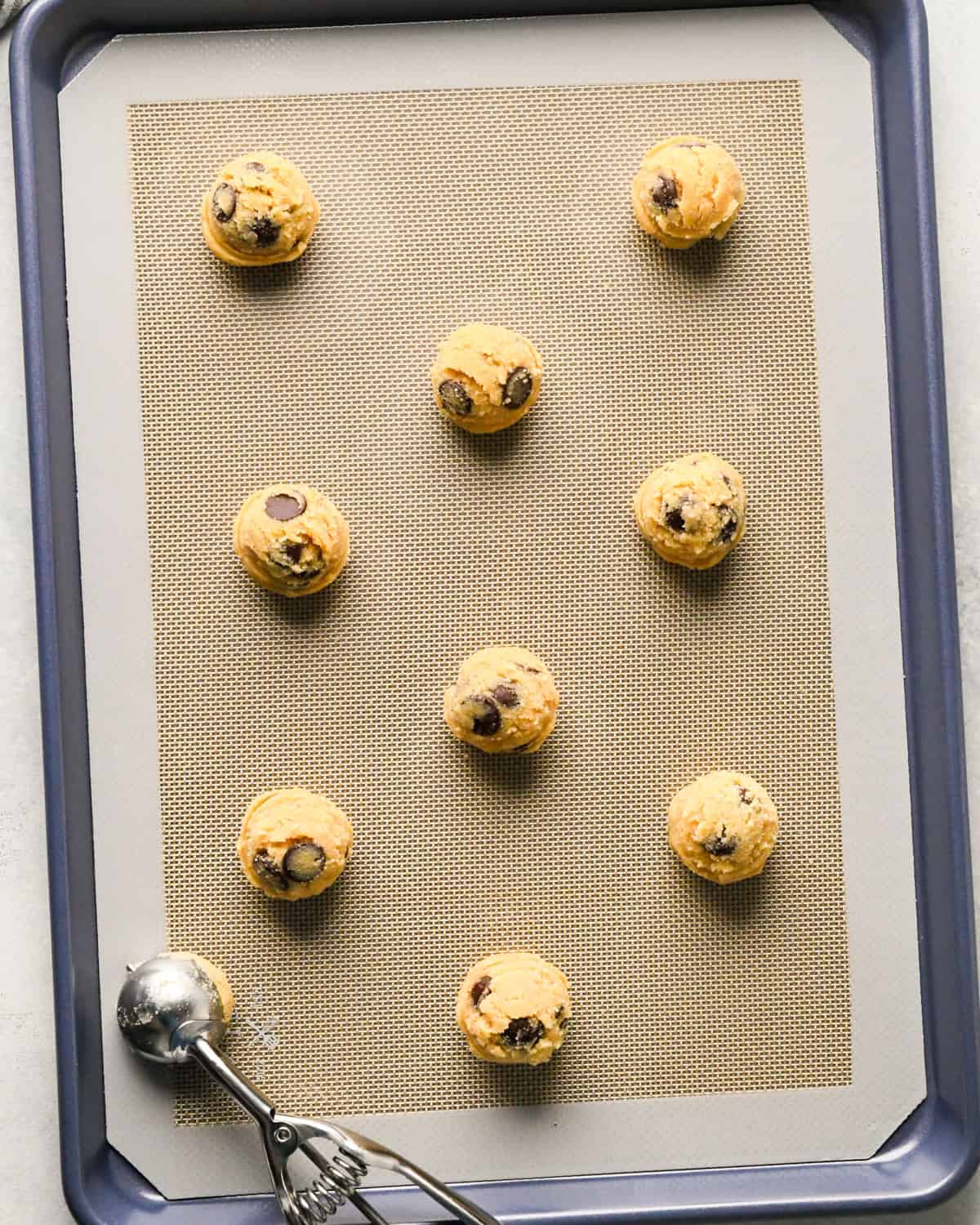 9 Coconut Flour Cookies on a baking sheet before baking