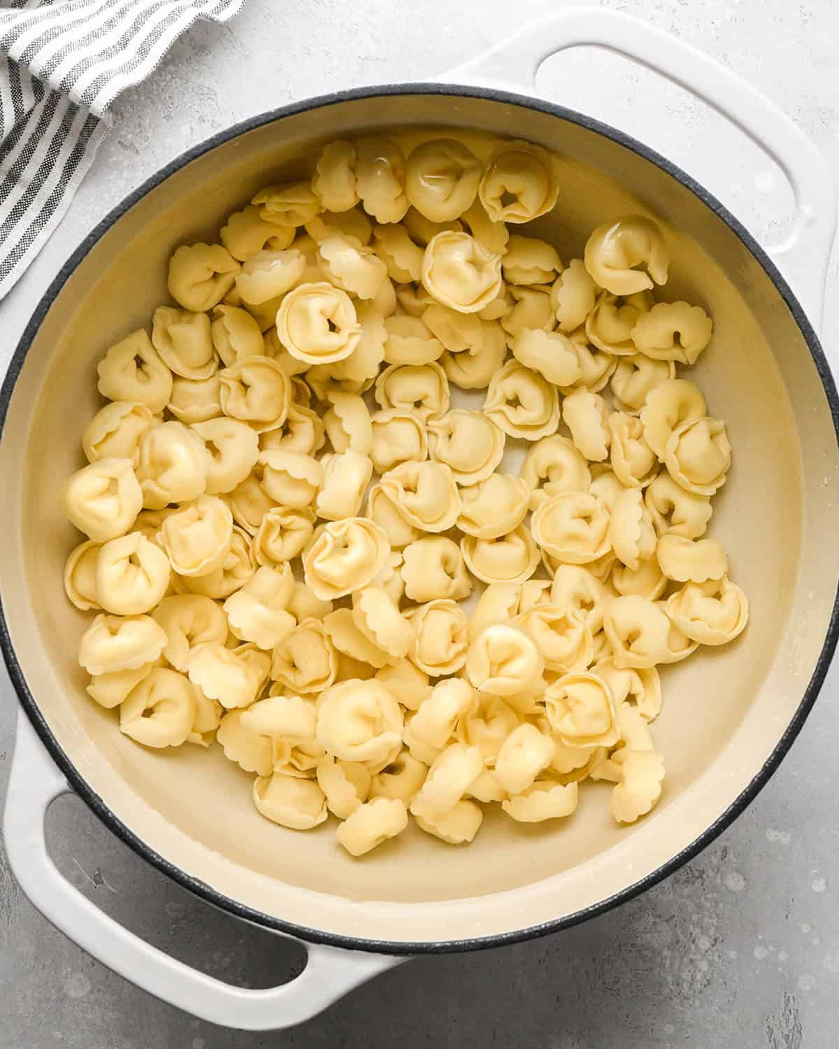 tortellini cooking in a pot of water