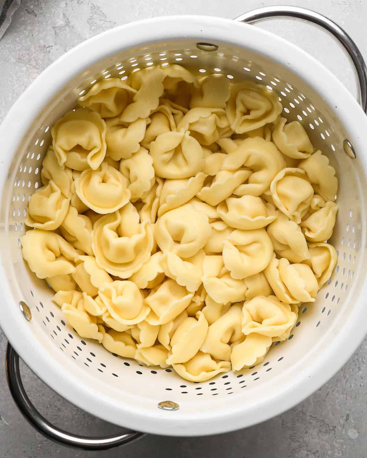 cooked tortellini in a colander